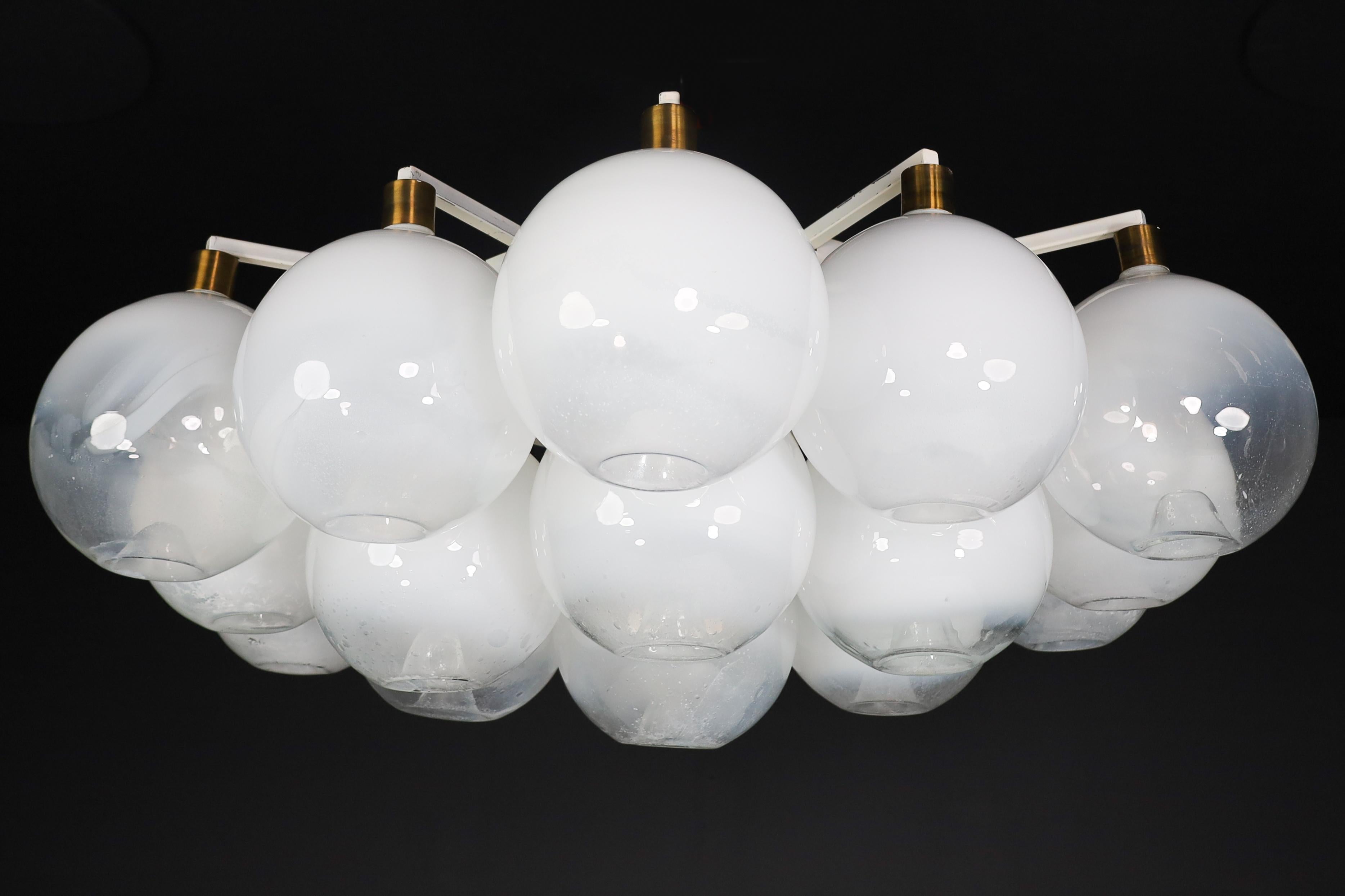 XL Flush Mount / Chandelier with Frosted Globes and Brass, Italy, 1960s

XL flush mount - chandelier (diameter 150 cm) with hand-blowed frosted glass globes with brass details, produced and designed in Italy in the 1960s. Nineteen large hand-blew