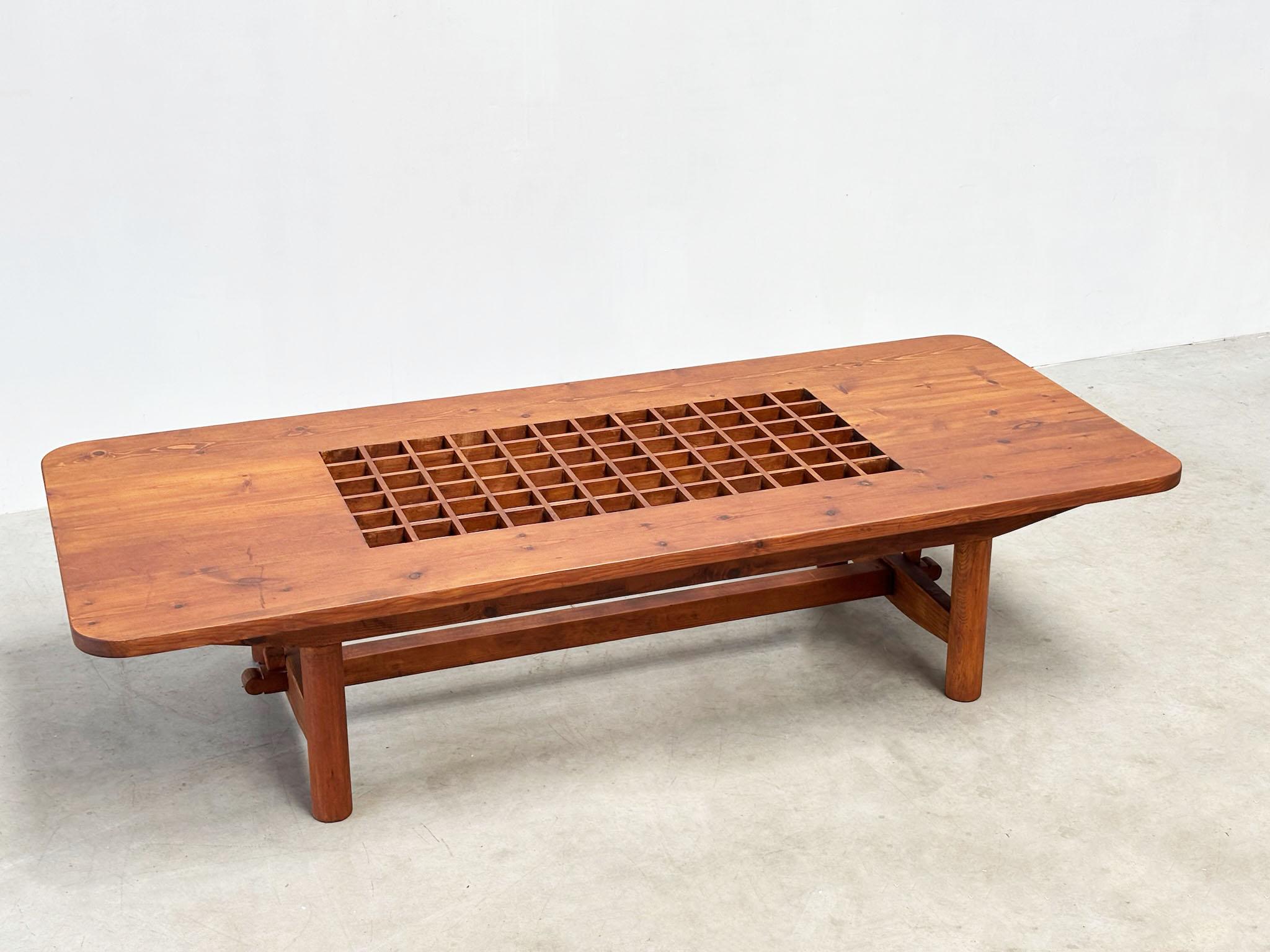 This exceptional French coffee table from the 1970s stands out for its refined craftsmanship and impressive length—measuring a remarkable 200 cm wide.

 

At the center, a beautiful geometric pattern adds visual interest and character, making it a