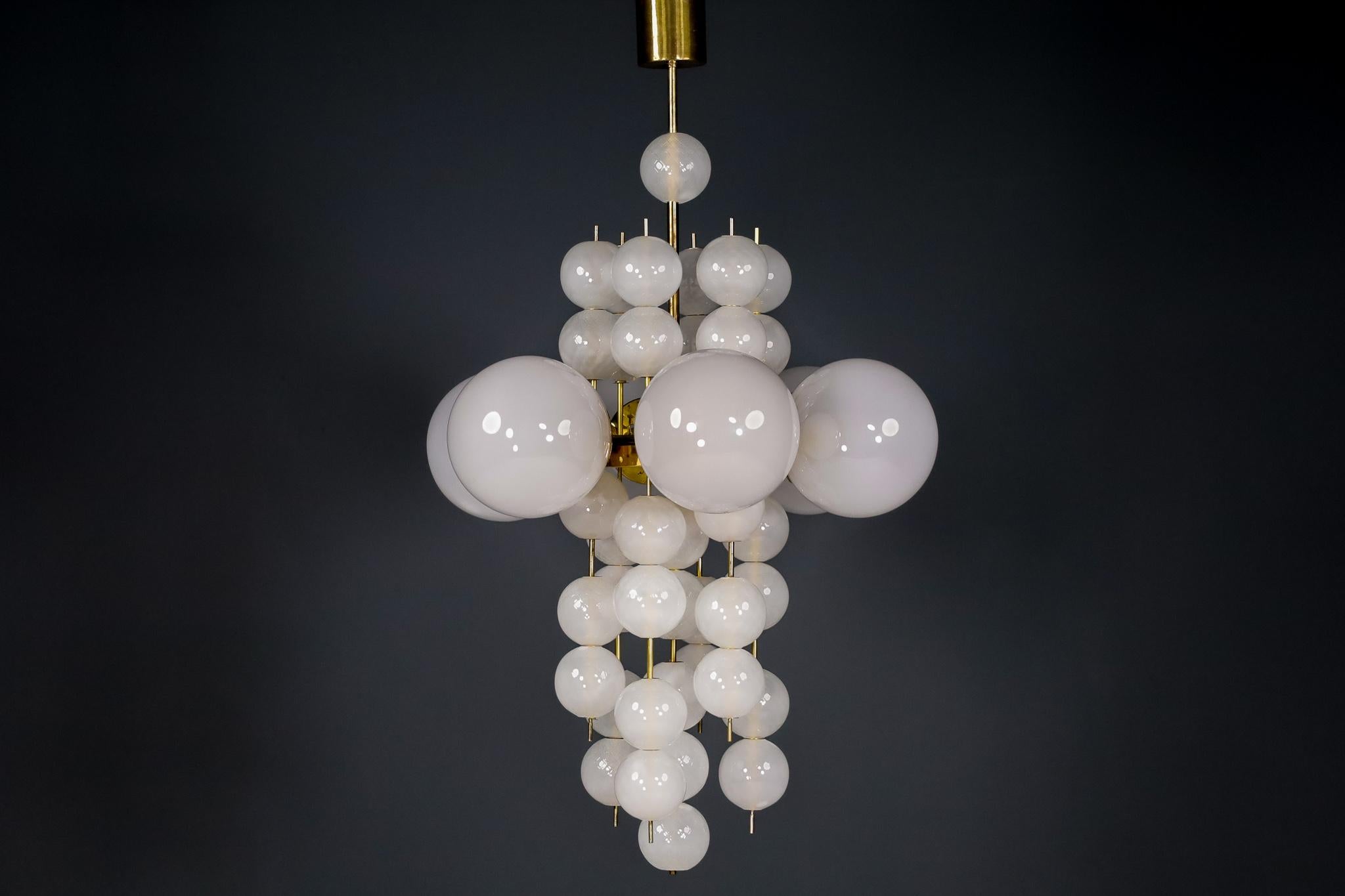 XL hotel chandelier with brass fixture and hand-blowed frosted glass globes by Preciosa, Czechia.

Large hotel chandelier with brass fixture produced and designed in Czechia by the famous Preciosa Factory. Total 6 large hand blowed frosted glass