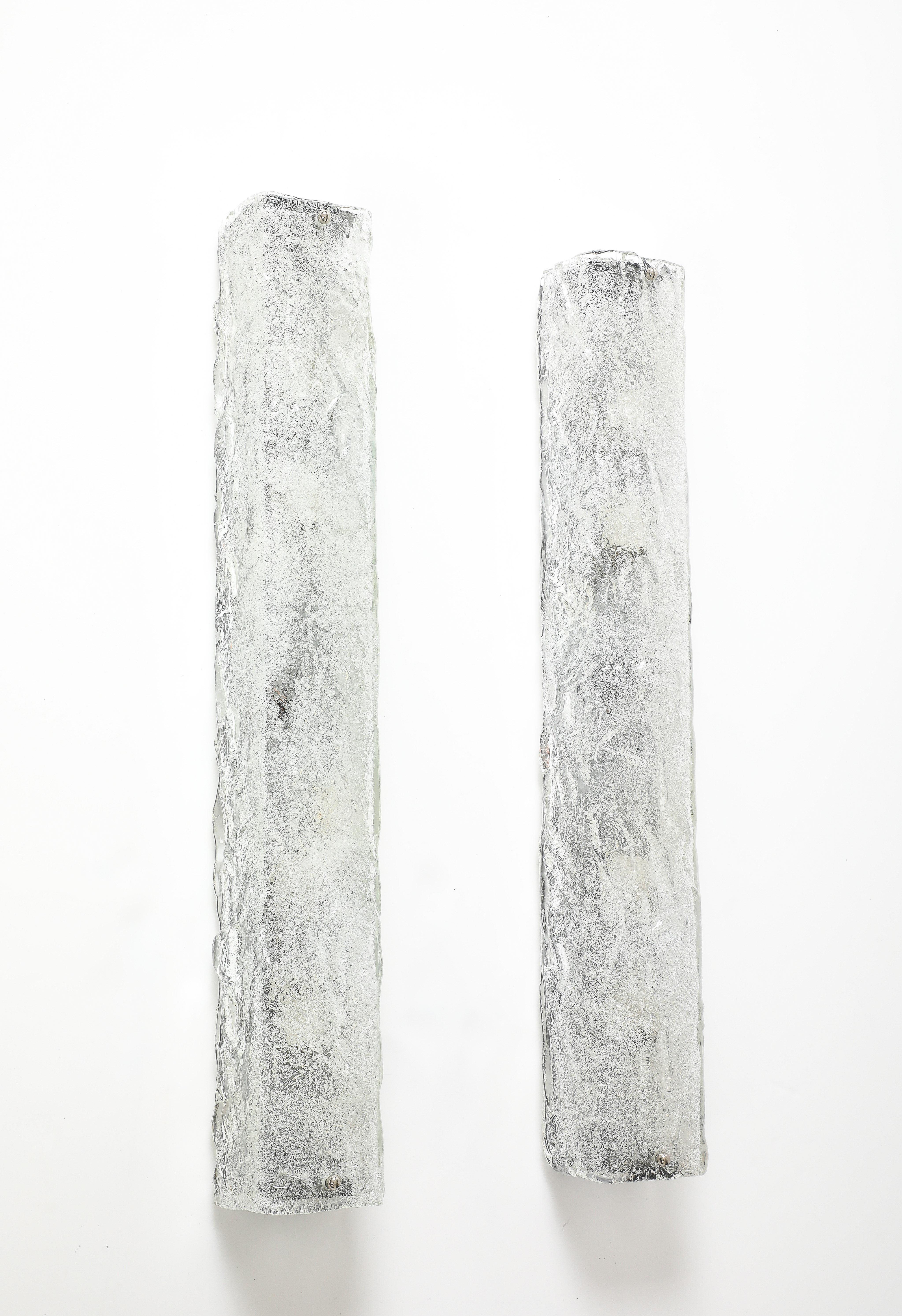 Rare pair of large scale Scaninavian Modern rectangular ice glass sconces
with nickel finials. Professionally rewired for use in the USA.