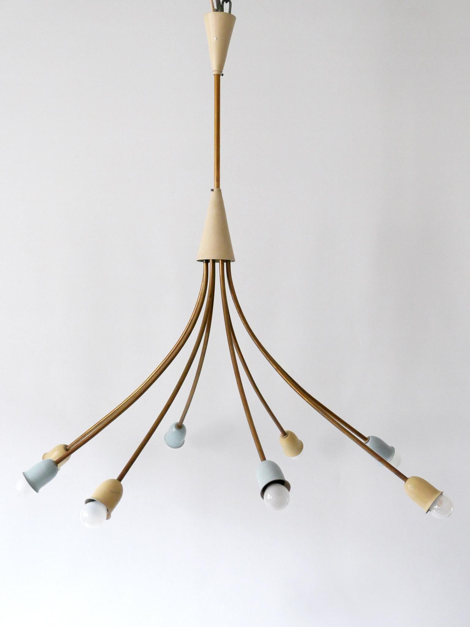 Extremely rare & highly decorative Mid-Century Modern eight-armed sputnik chandelier or pendant lamp in pastel colors. Designed and manufactured in Germany, 1950s.

Executed in brass and aluminium, the lamp needs 8 x E14 / E12 Edison screw fit