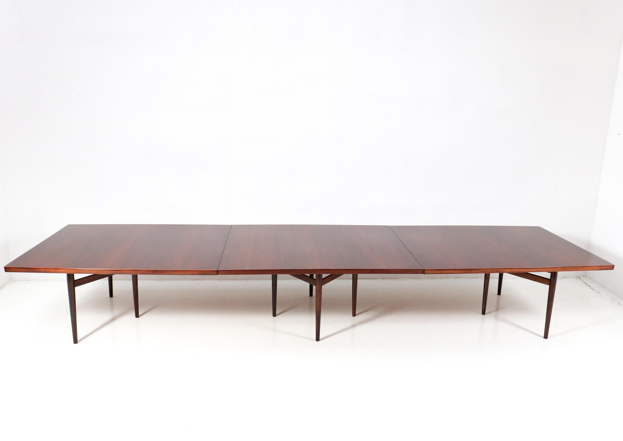 Magnificent and rare extra large Mid-Century Modern Model 201
 conference table.
Design by Arne Vodder for Sibast Mobler Denmark.
Striking Danish design from the 1960s.
Three solid rosewood sections connected with four original rosewood