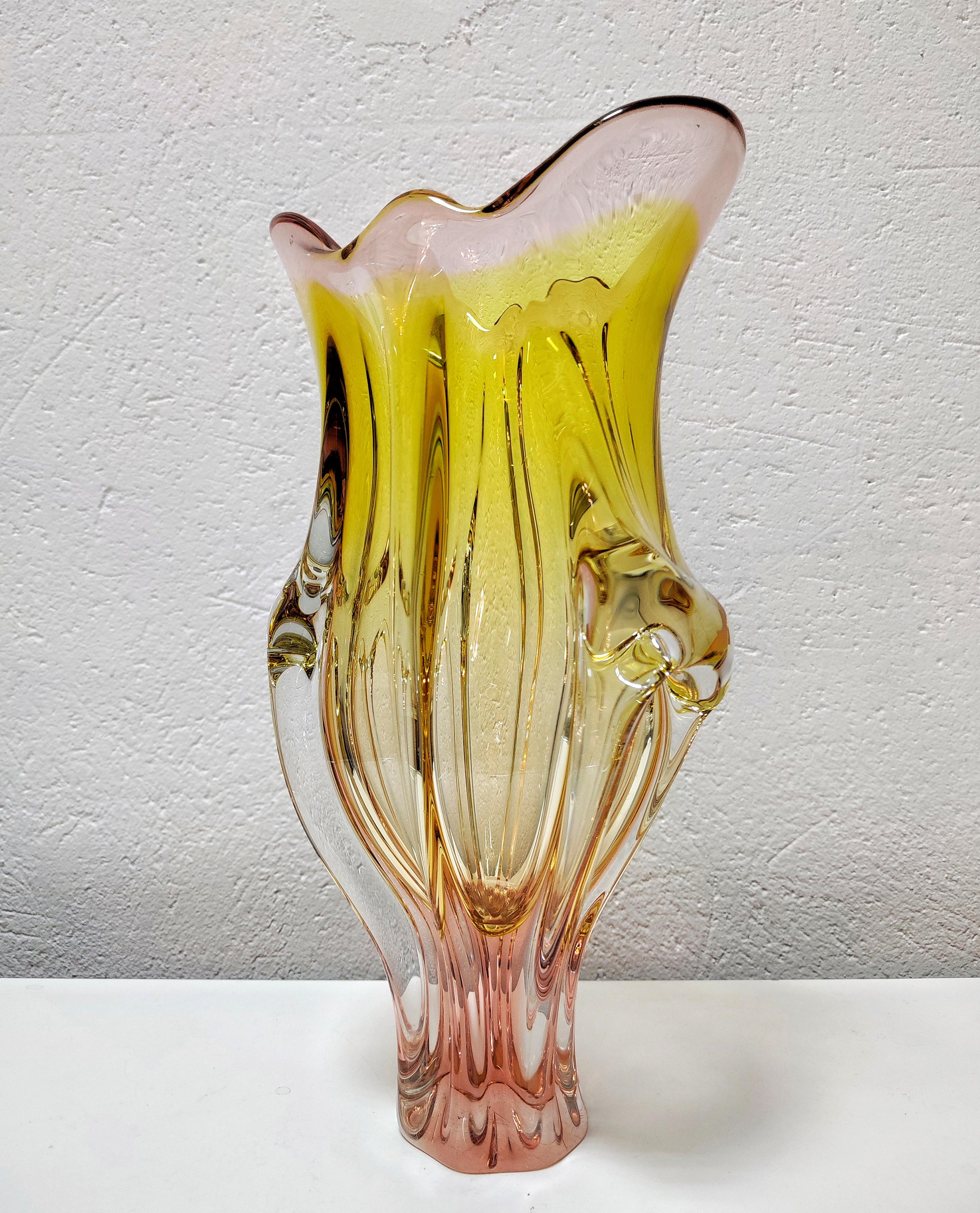 This listing features a large, pink and yellow vase shaped as a flower bud.

It was designed by Josef Hospodka, an artist from Czechoslovakia who was working for glass factory SKLO.

Made in Czechoslovakia. 

Minor signs of use are visible on its