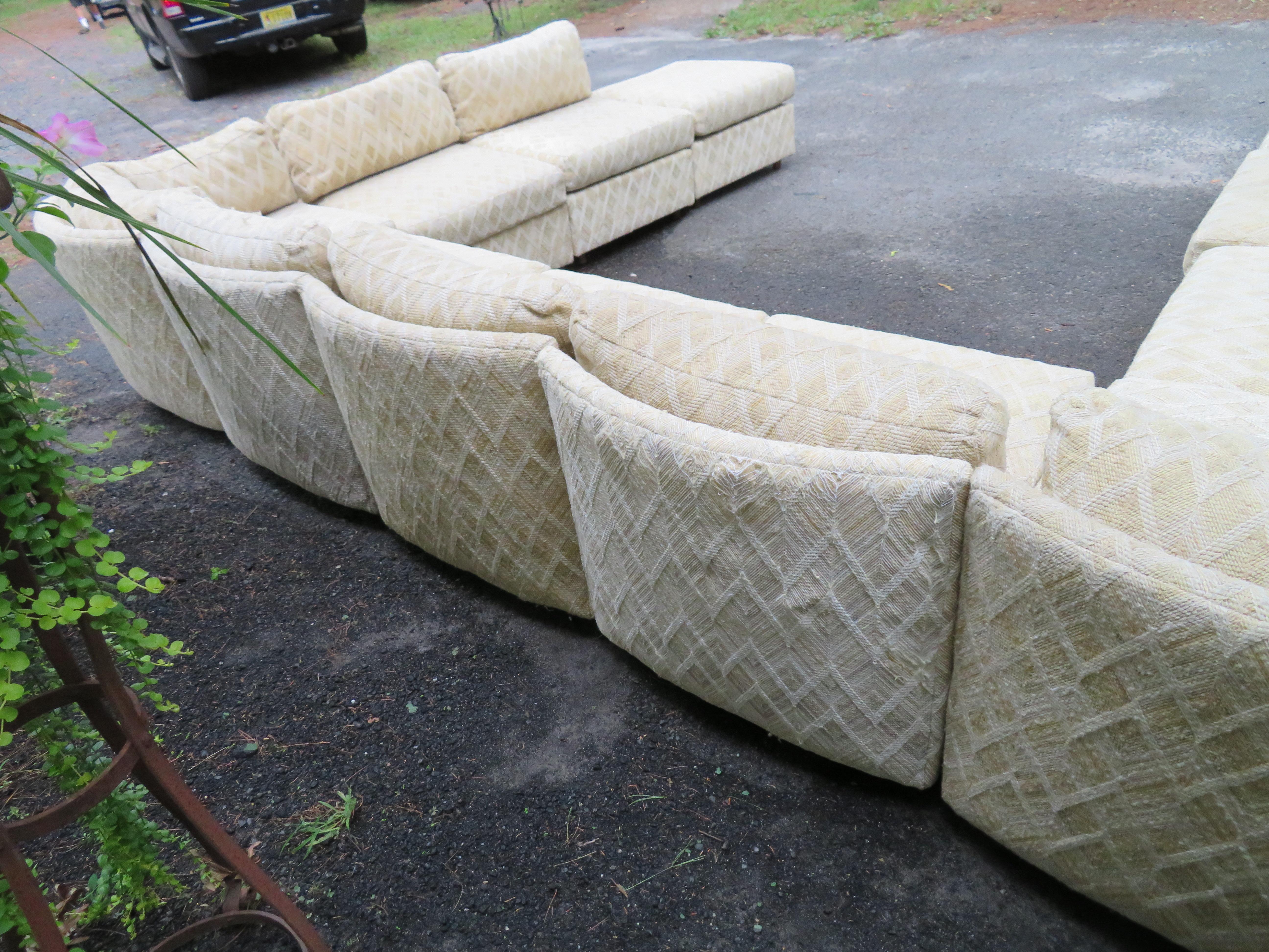 Wonderful 11-piece Milo Baughman curved back cube sectional sofa. This set is in nice vintage condition but the fabric is dated and shows a lot of wear so we highly recommend re-upholstery. This is the biggest cube sectional we have ever had. The