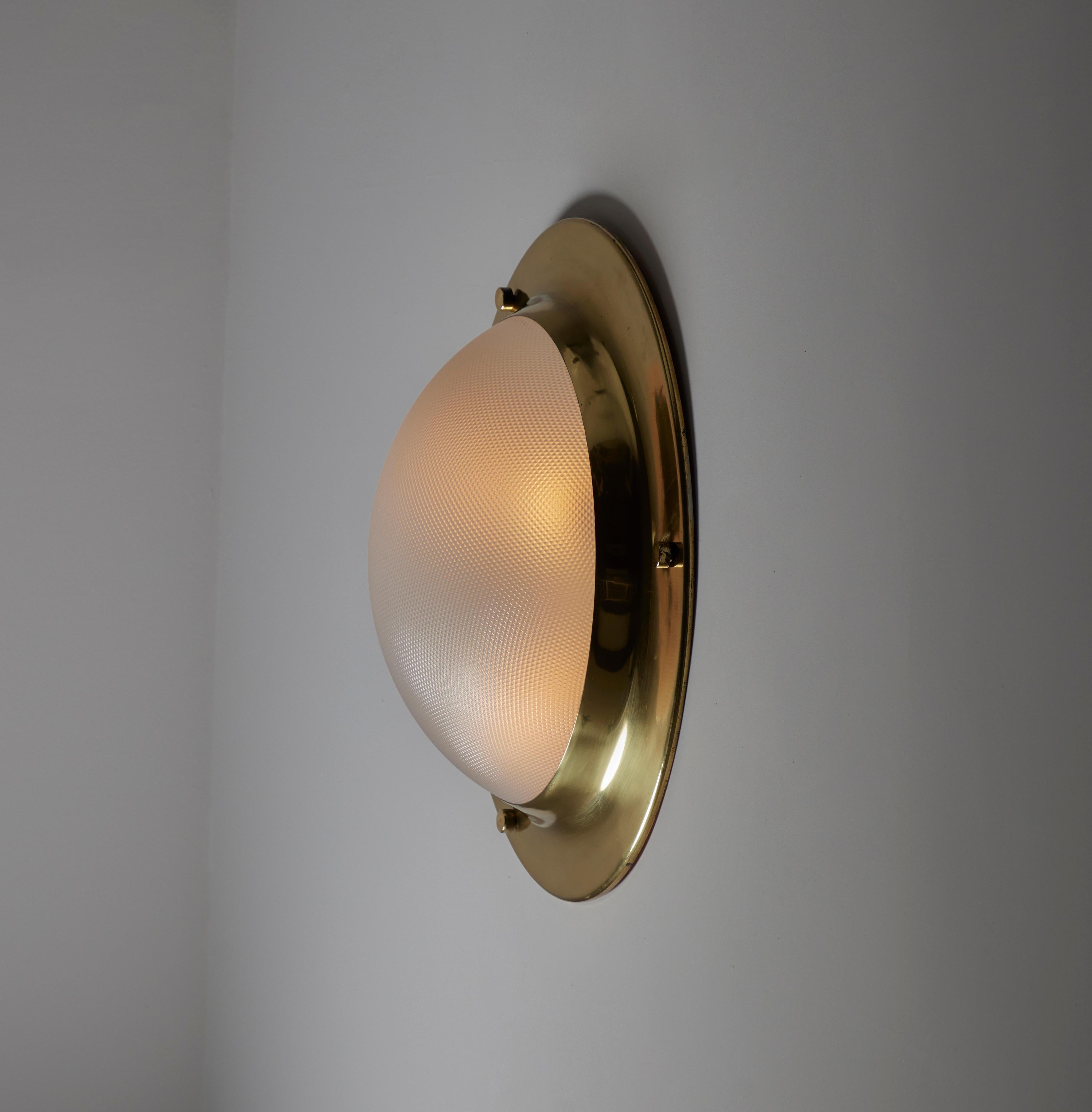 XL Model LSP6 'Tommy' Flush Mount by Luigi Caccia Dominioni for Azucena. Designed and manufactured in Italy, circa the 1960s. Nautical style XL sconce featuring a polished brass rim and a cross-hatched textured acrylic diffsuer. The light holds a