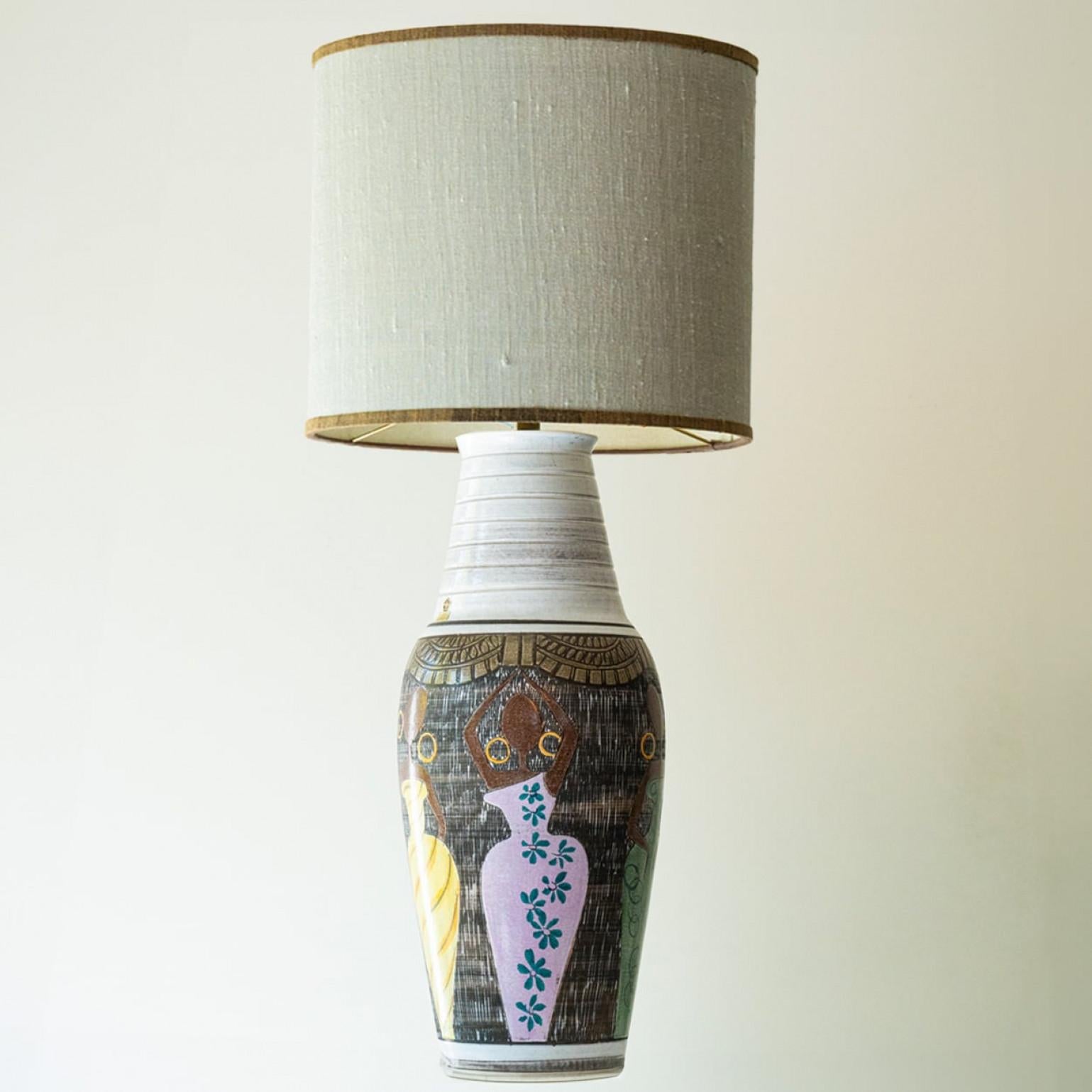 XL  heavy quality ceramic table or floor lamp,  1970s.

This lamp base brings refined elegance and rich visual appeal to any interior. With its beautiful shape, it offers a unique presence.

This base with  multicolored shades and nice patterns fits