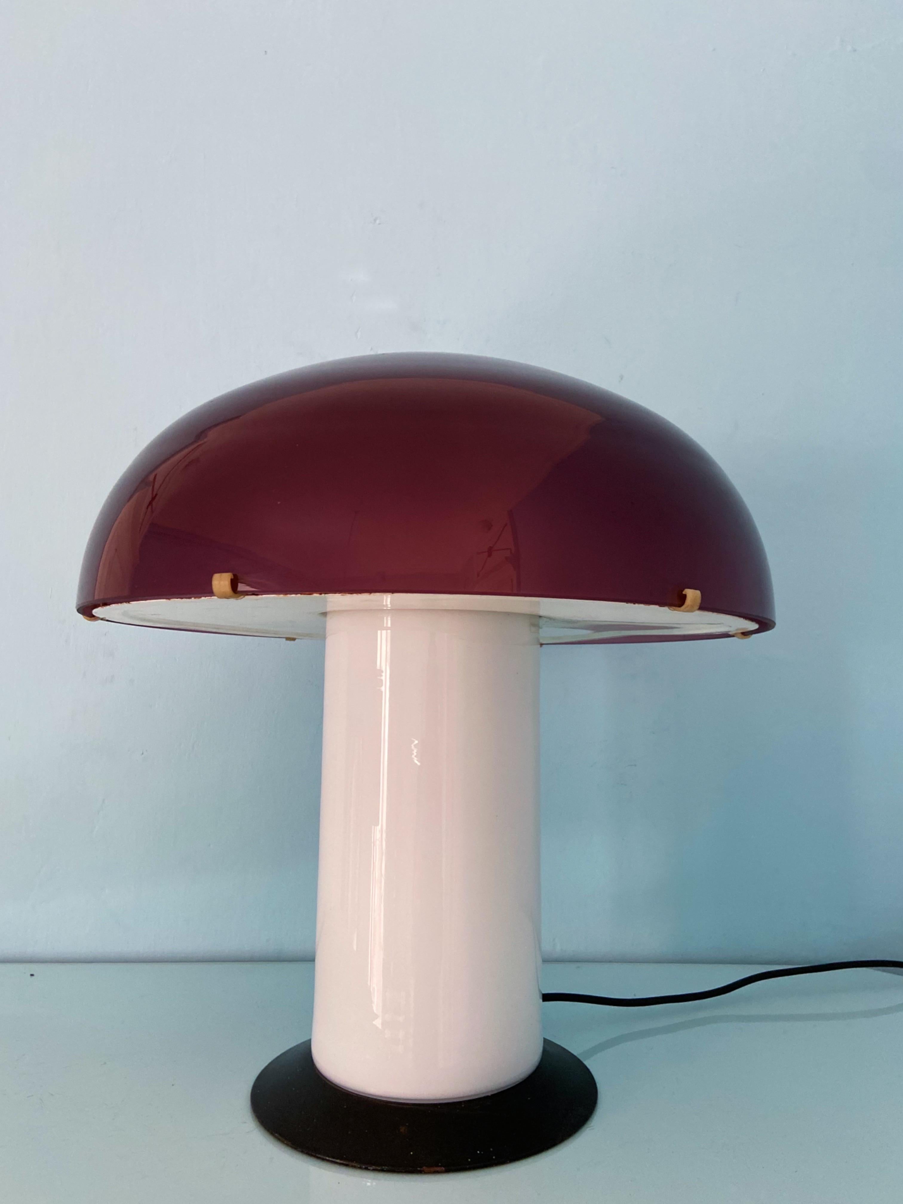 This XL mushroom lamp is designed by the iconic designer Federico De Majo.
You can have the top or bottom lit or both at the same time.

The top goes in a violet color and towards pink when lit.
Original label on the glass, both on the bottom