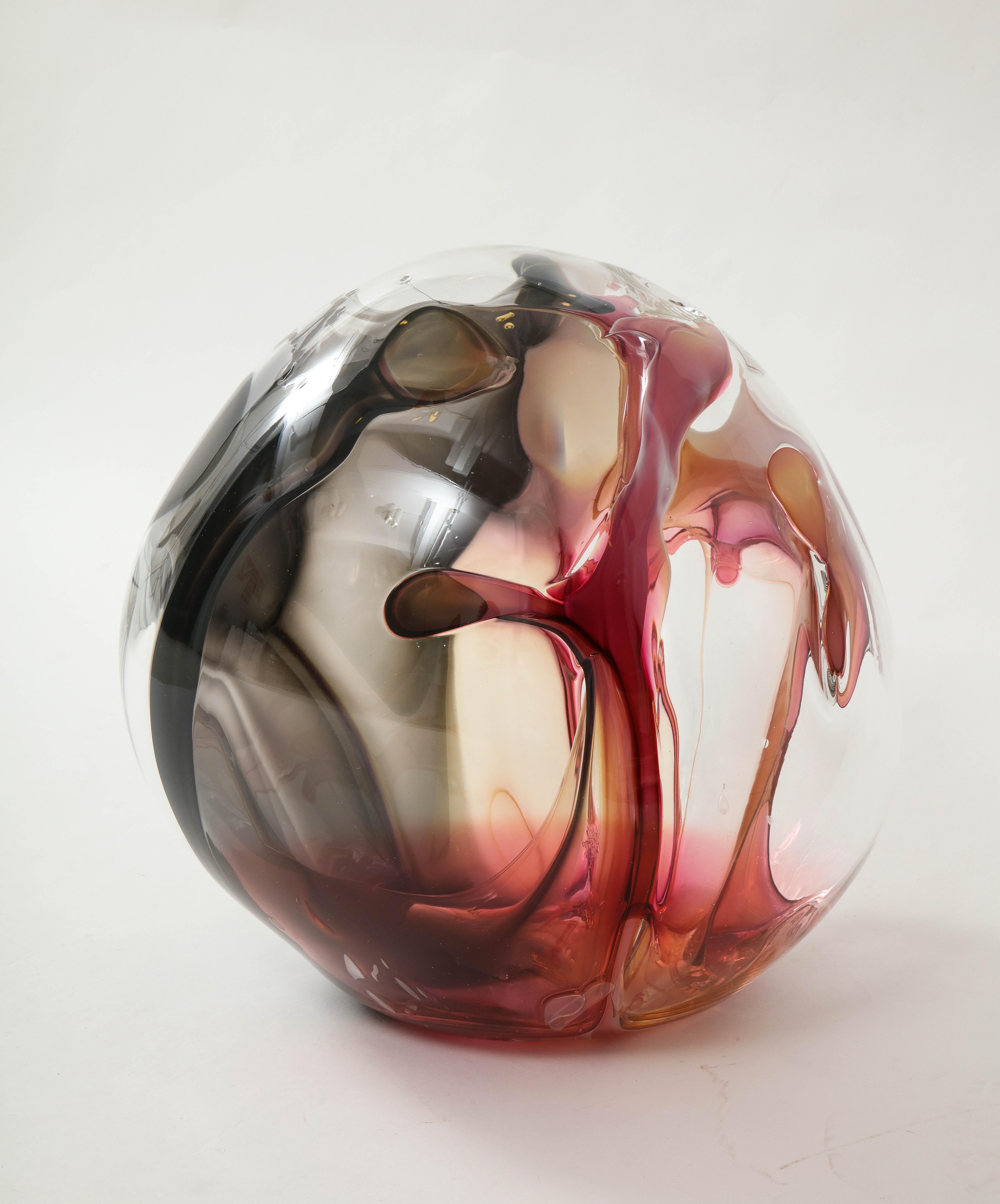 Extra large hand blown glass orb sculpture with internal glass threads of
Magenta, white, dark red, grey and black.
Signed and dated on the bottom by Peter Bramhall.