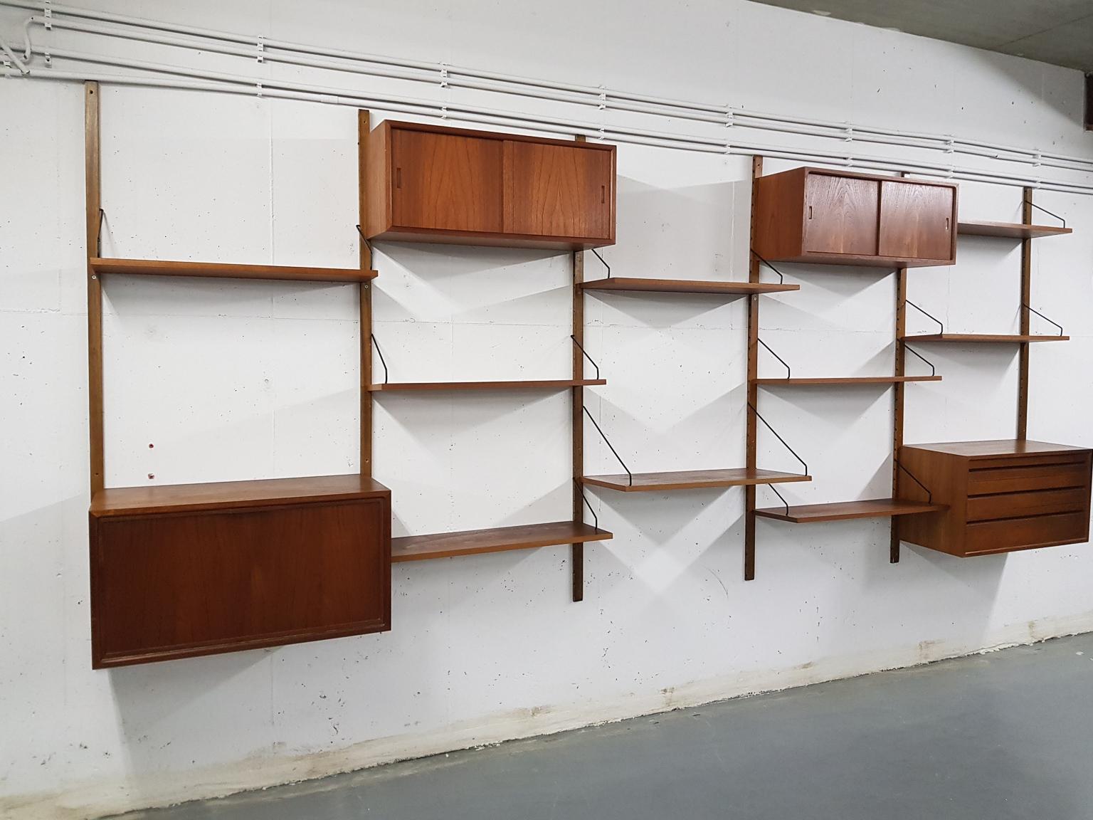 Extra large Danish design wall system or shelving unit by Poul Cadovius for Royal System, designed in Denmark in 1948.

When you ask someone to think of an European midcentury wall unit, most will probably think of Poul Cadovius and his shelving