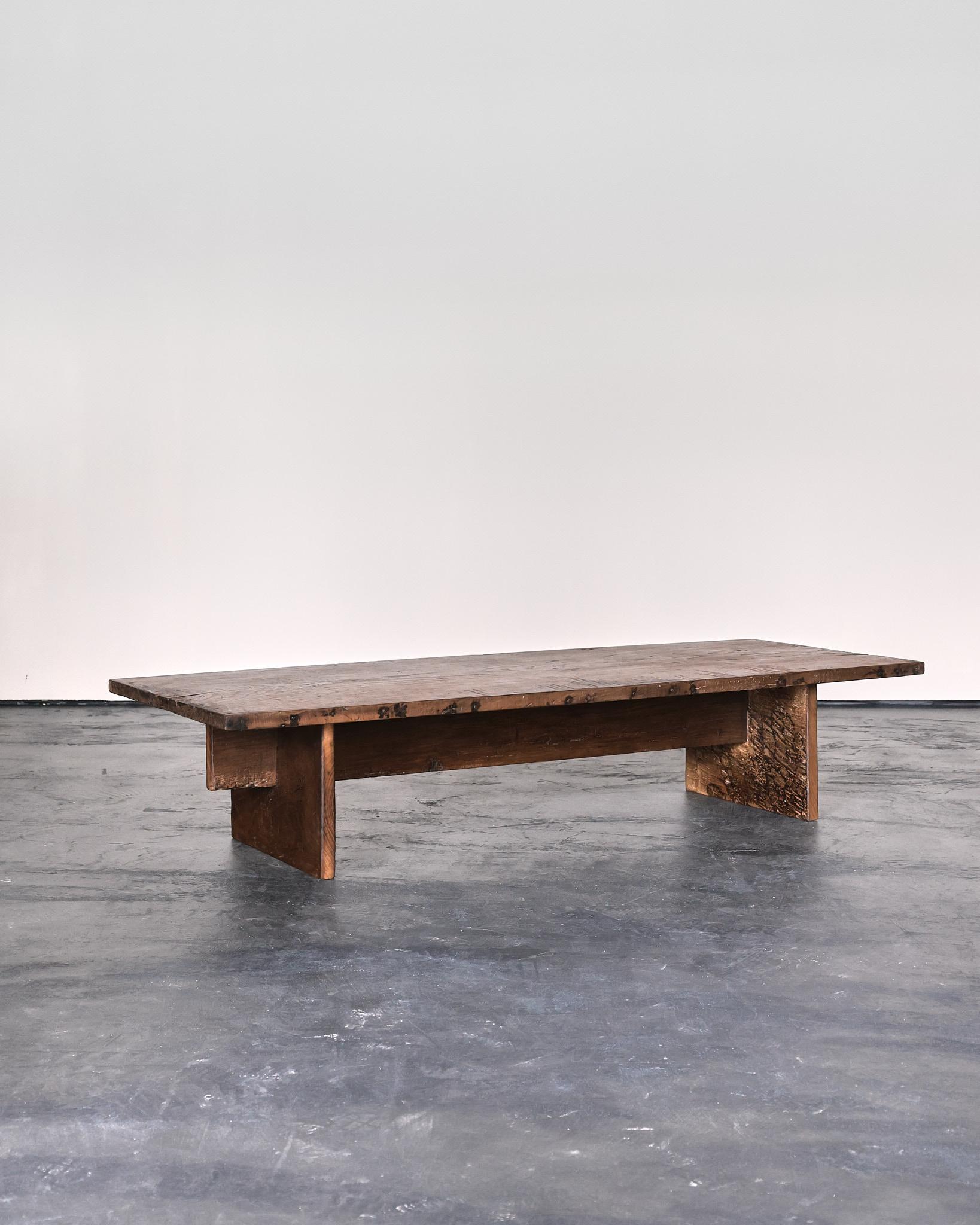 A primitive low table/coffee table in heavily patinated 18th C. Portuguese chestnut.

Single piece top.

Designed and built by us in our London workshop.

Complimentary worldwide shipping.