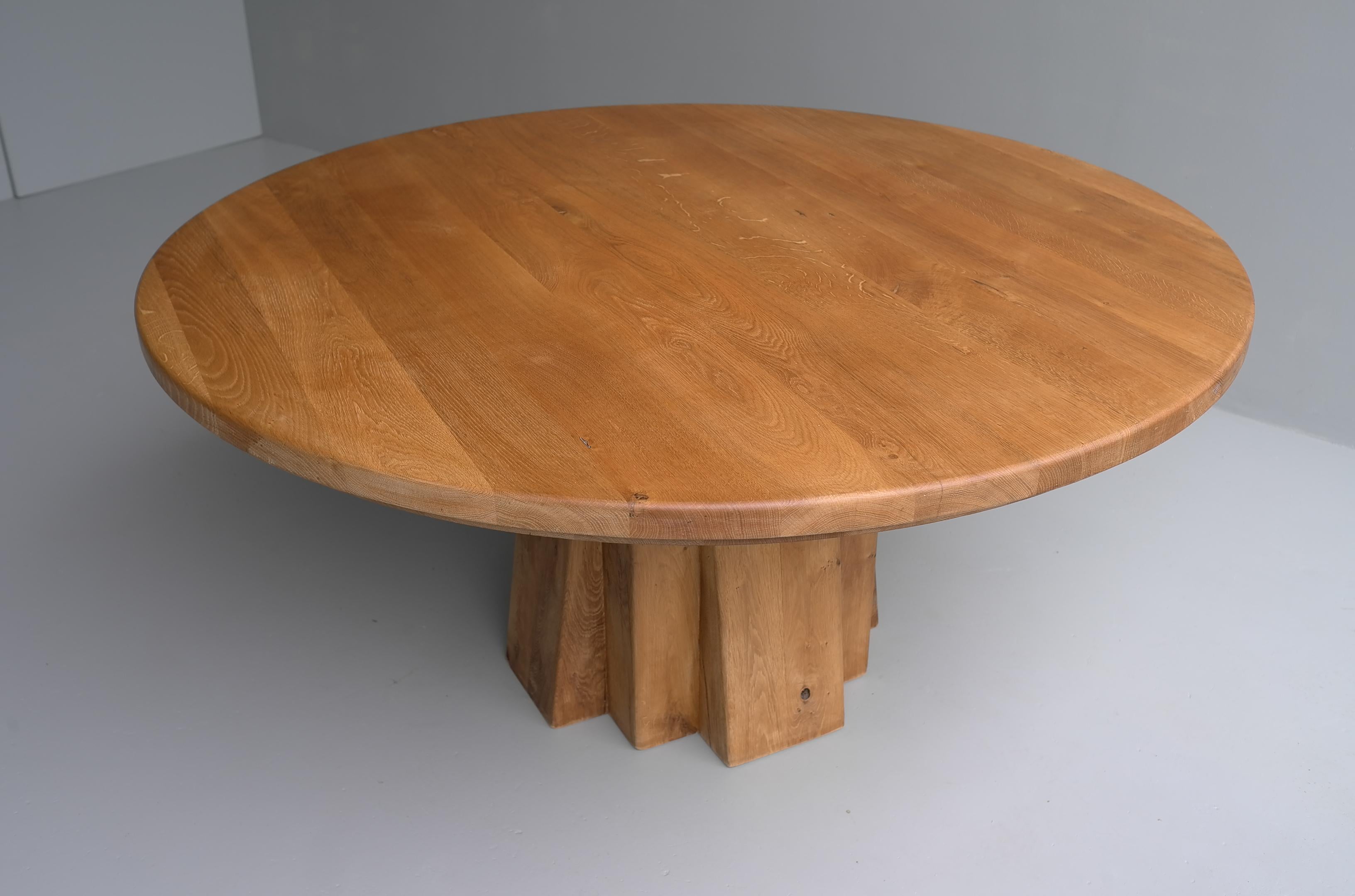 This very large round table is made from solid oak with a unique sculptural carved base. Very heavy and solid piece.
The table is only finished with natural beeswax so the lovely texture from the wood is clearly visible.
The size from the table