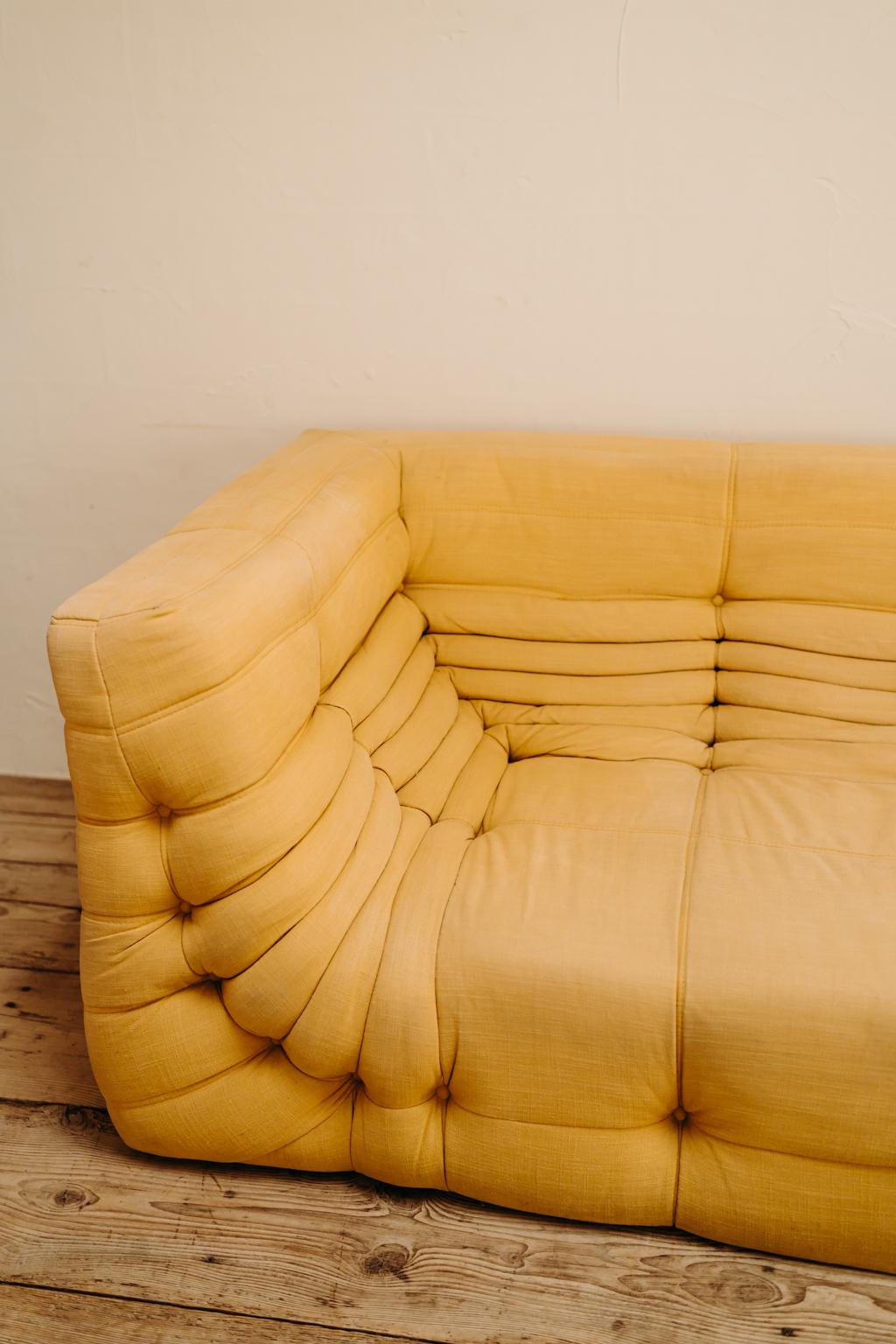Great sofa in a wonderful soft yellow fabric, in very good vintage condition.