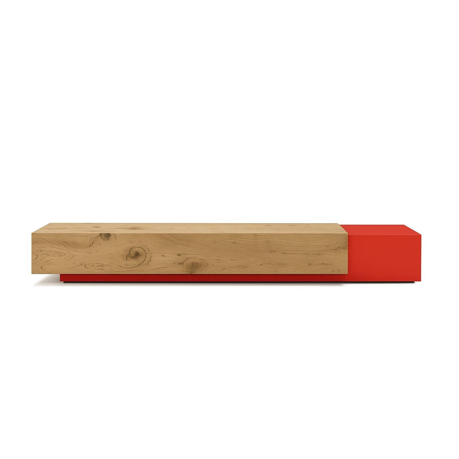 This sculptural bench is a striking composition of two integrated parallelepipeds, designed to evoke the image of an object and its shadow. It is crafted from two distinct materials: a solid, squared block of scented cedarwood is seamlessly joined