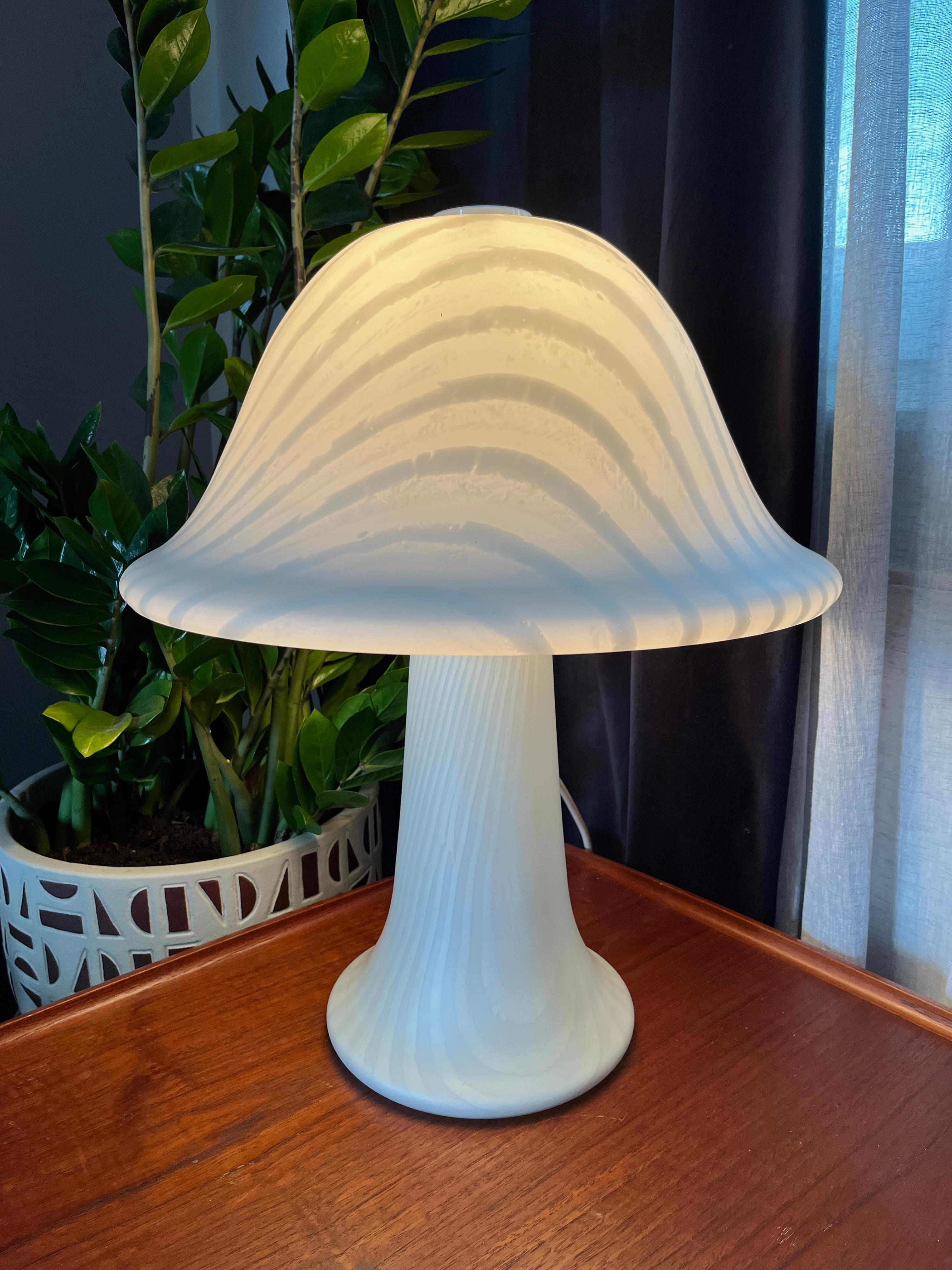 Very beautiful hand-blown Murano table lamps (made from a single piece) by Peill & Putzler.
Peill & Putzler produced these mushroom lamps in many different shapes and sizes. This is the largest.

Beautiful mid-century design glass with two E27