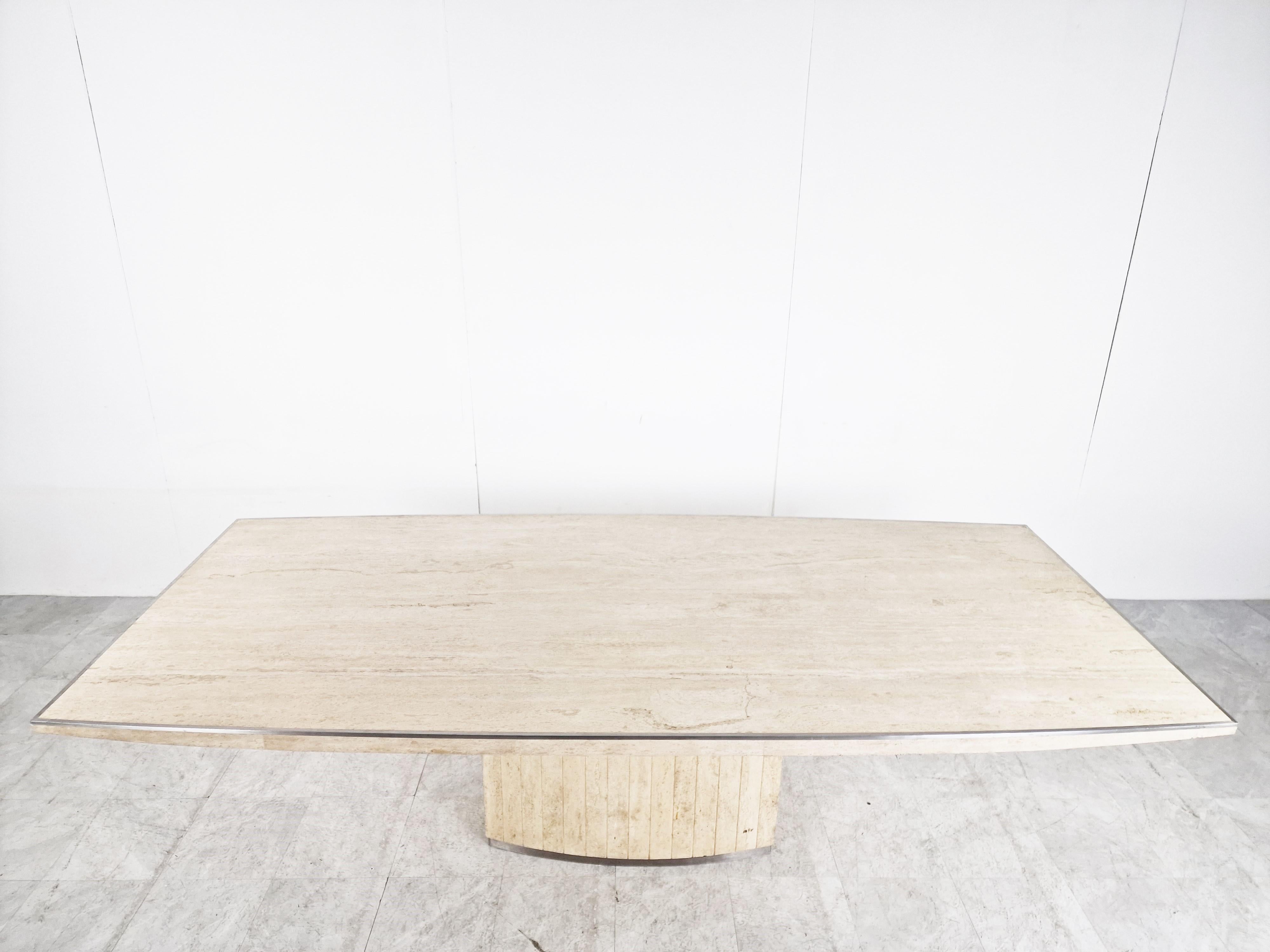 Rare signed dining table in travertine by Willy Rizzo.

The table is signed on the bottom right.

Brushed aluminum finish on the edges and on the base. 

1970s - Italy

Measures: H 29.53 in. x W 798.42 in. x D 43.31 in.
H 75 cm x W 250 cm x