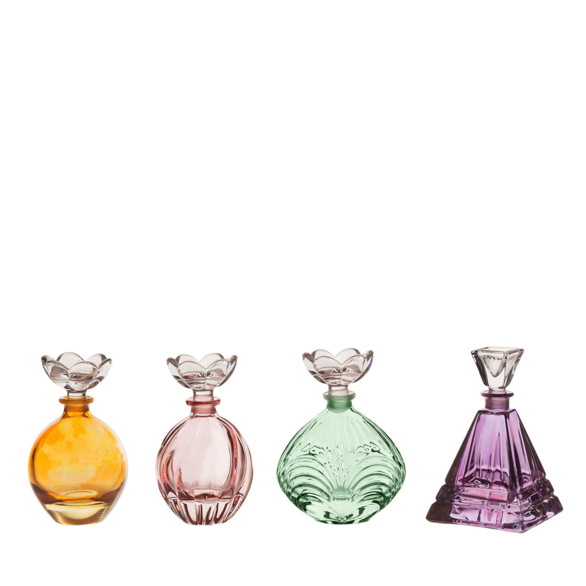 Part of the Xmas Collection, these elegant crystal perfume bottles are a superb addition to a vanity table in a bedroom or powder room. The traditional silhouette, the handmade etched decorations on the bottle, and the transparent, flower-shaped