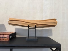 Sculture in bosso, lucidissime e intagliate per la contemplazione, fiume fluente