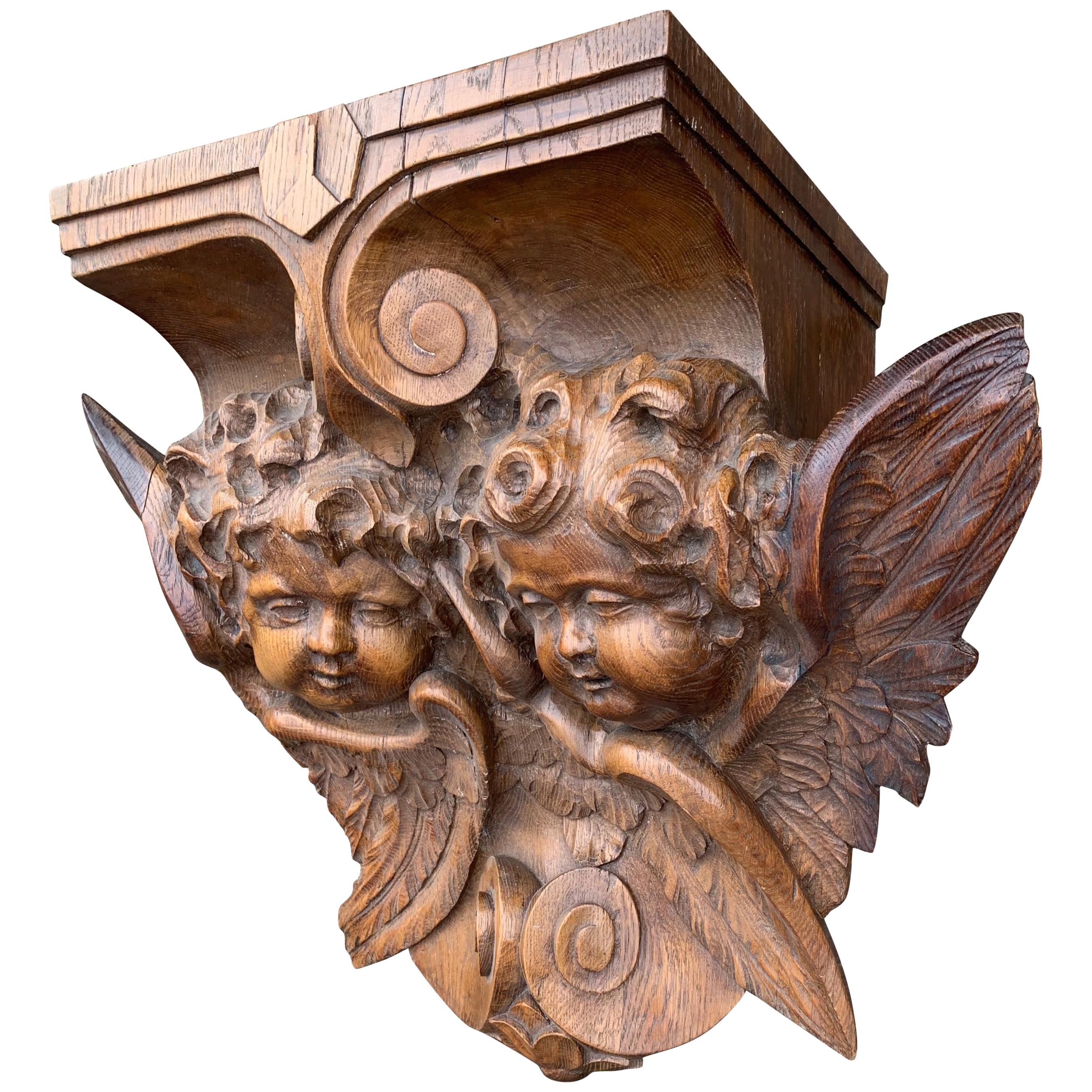 Stunningly hand carved Gothic Art wall bracket / corbel with winged angel sculptures.

In his lifetime, Belgian architect and publicist Auguste Van Assche (1826-1907) created and renovated many churches and monasteries and he was also known for his