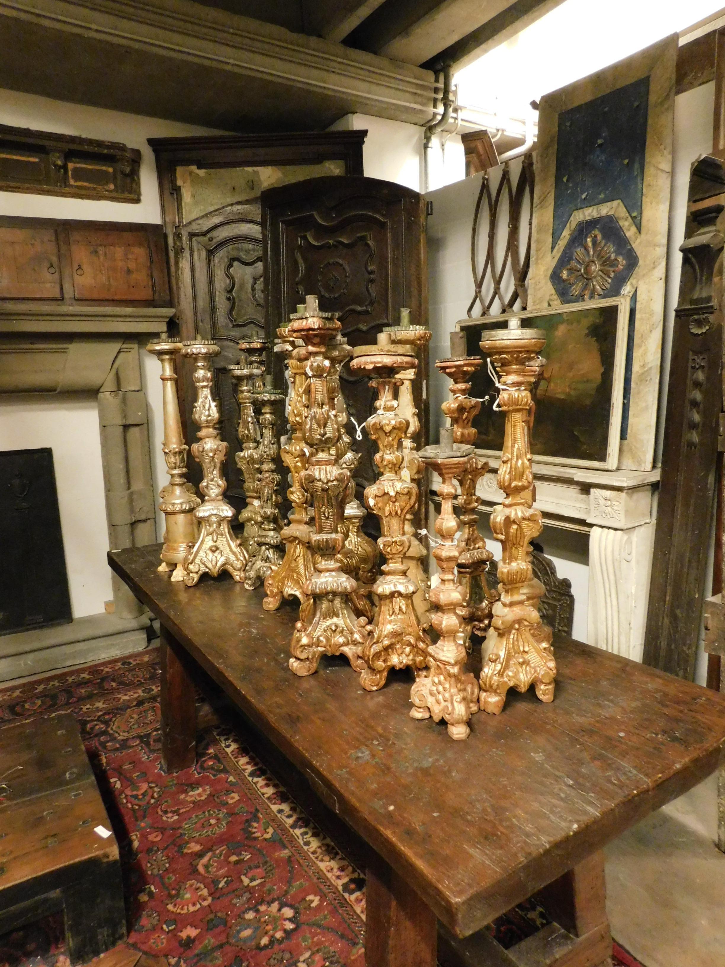 18th century antiques candelabra or light, in gilded wood from Piedmontese church, many different but equal in pairs, different sizes and decorations.