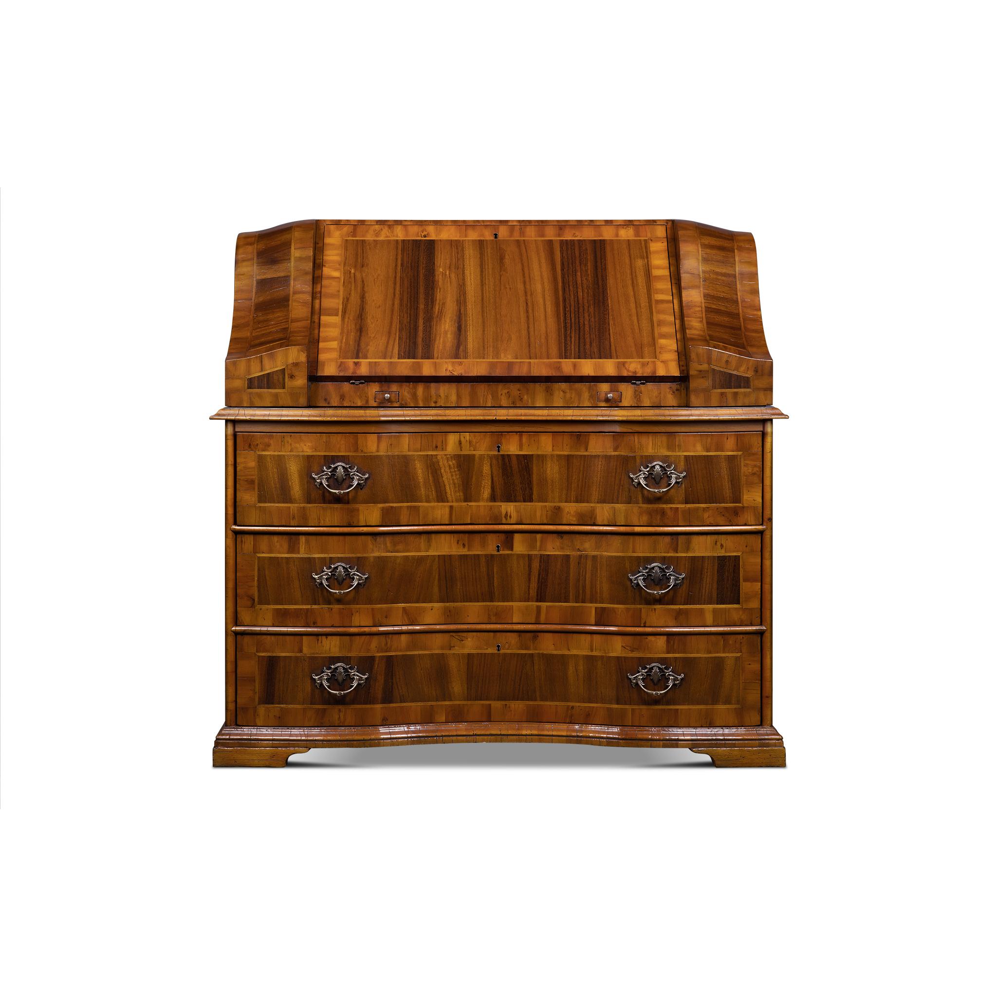The Amsterdam Chest is inspired by the XVIIIth century German design. Its serpentine front matches the style and design of that time. It has crossed moldings throughout the top and base. It Combines top class materials with beautiful craftsmanship