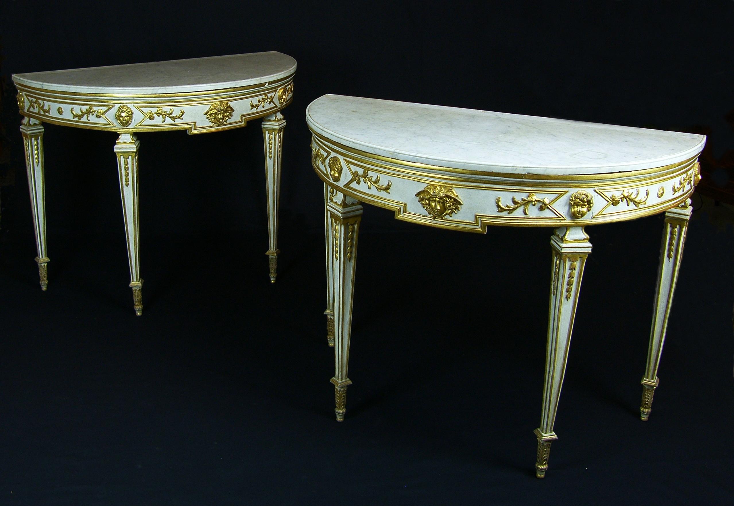 18th century, pair of Italian half-moon lacquered giltwood neoclassical consoles

These elegant wooden consoles finely carved, lacquered and golden, fully represent the taste that was established in Naples at the end of the eighteenth century, in