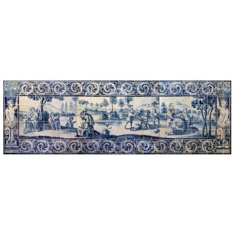 Blue and white panel representing an outside astrology class.
The  blue and white colors is an  influence by chinese porcelain and delft tiles and become fashion in the 18th century.
Tiles panels can be  wooden frame as a painting or embbeded