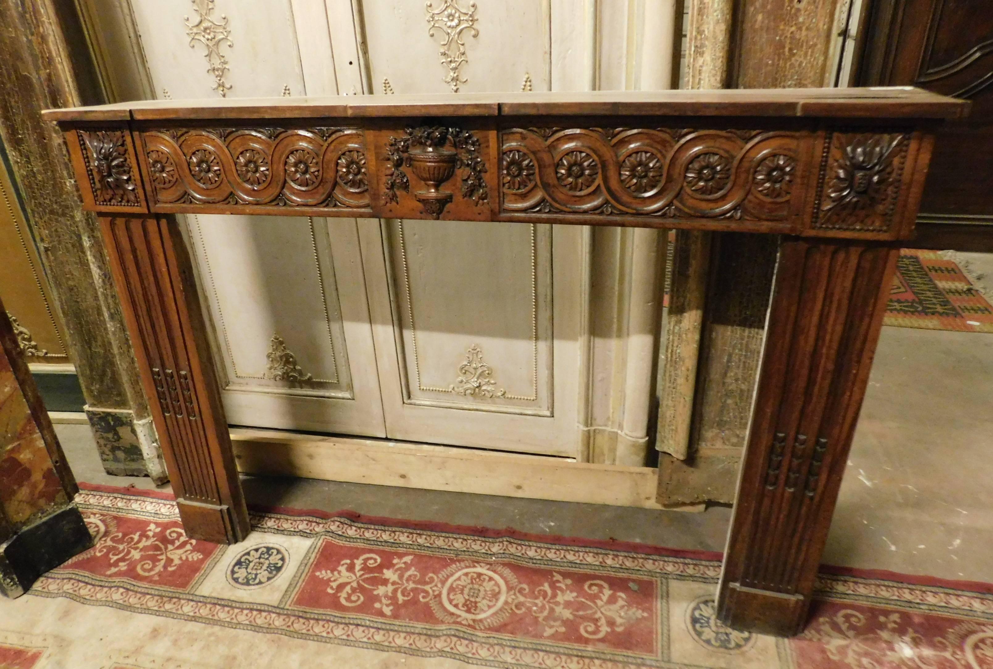 18th century richly carved wood fireplace mantel.