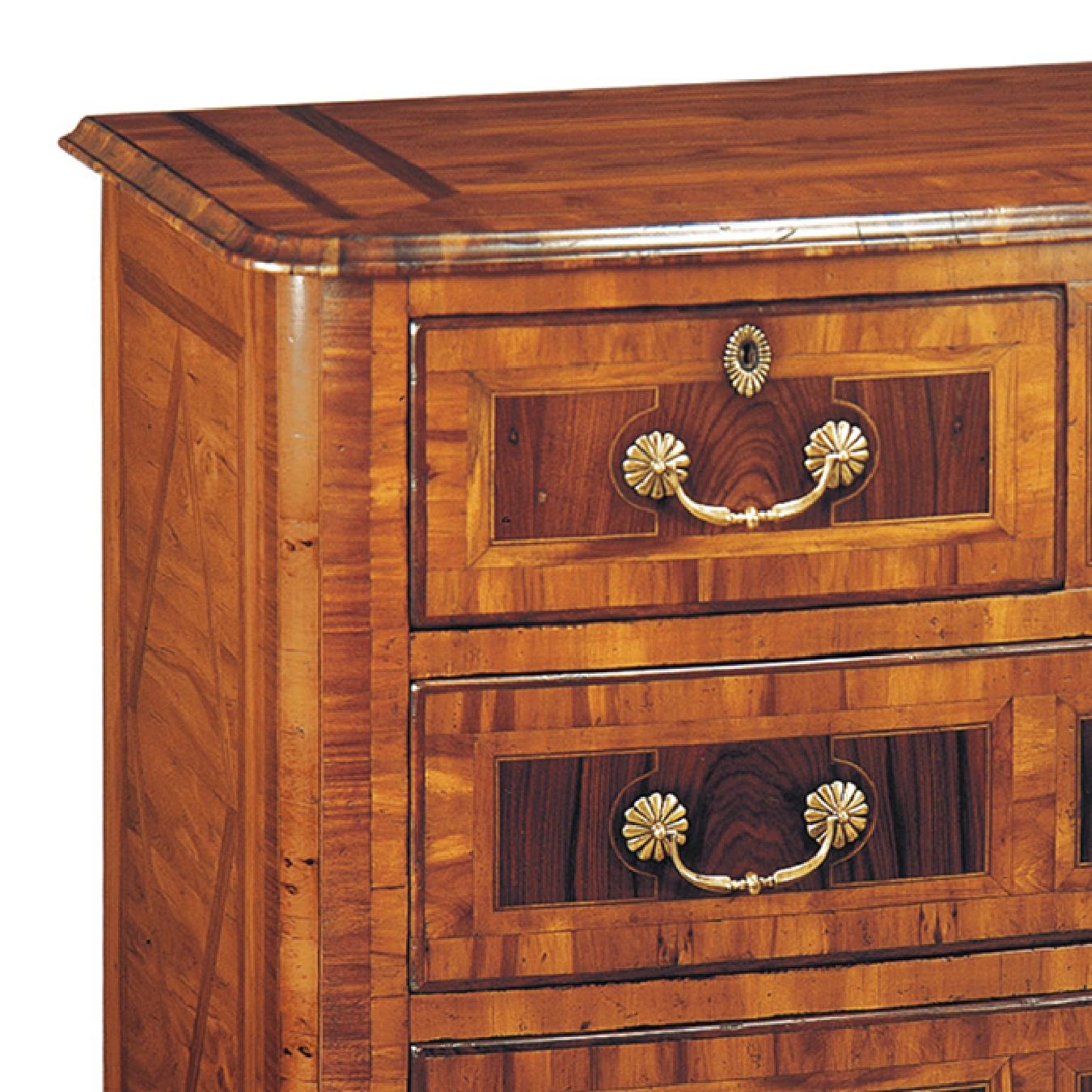 In the French Regency style, this XVIIIth Century Chest has a beautiful intricate marquetry work and is veneered in four types of wood: Yew, Rosewood, white cedar and granadillo. This detailing runs through the drawers, doors and sides of the piece,