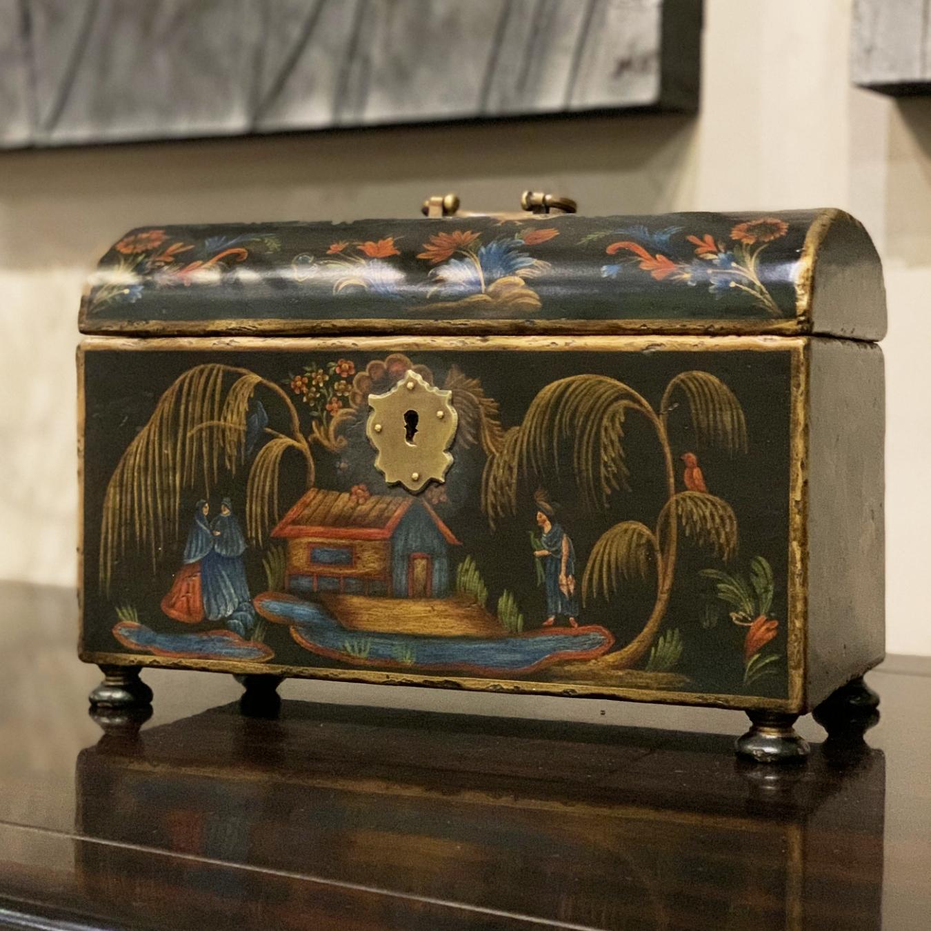 Our stunning Manila small coffer has colorful and intricate hand-painted scenes the immediately grab your attention. It is inspired by similar pieces from the XVIIIth Century, especially by the Michoacan tradition of lacquered furniture. It has