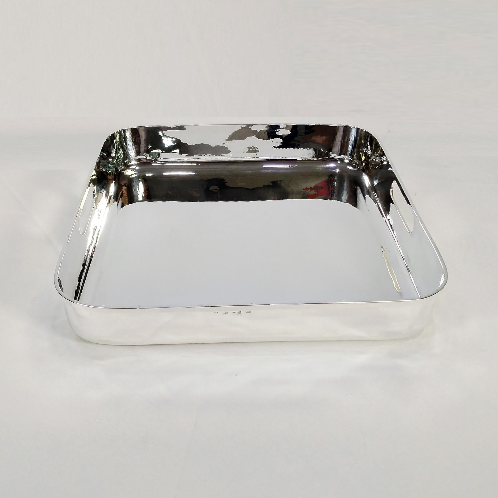 800 silver tray with a high edge, completely handmade.
On the edge of the tray, two holes with a re-edged interior have been made to act as handles and to make the tray easy to carry when it supports heavy weights.
The tray was made starting from a