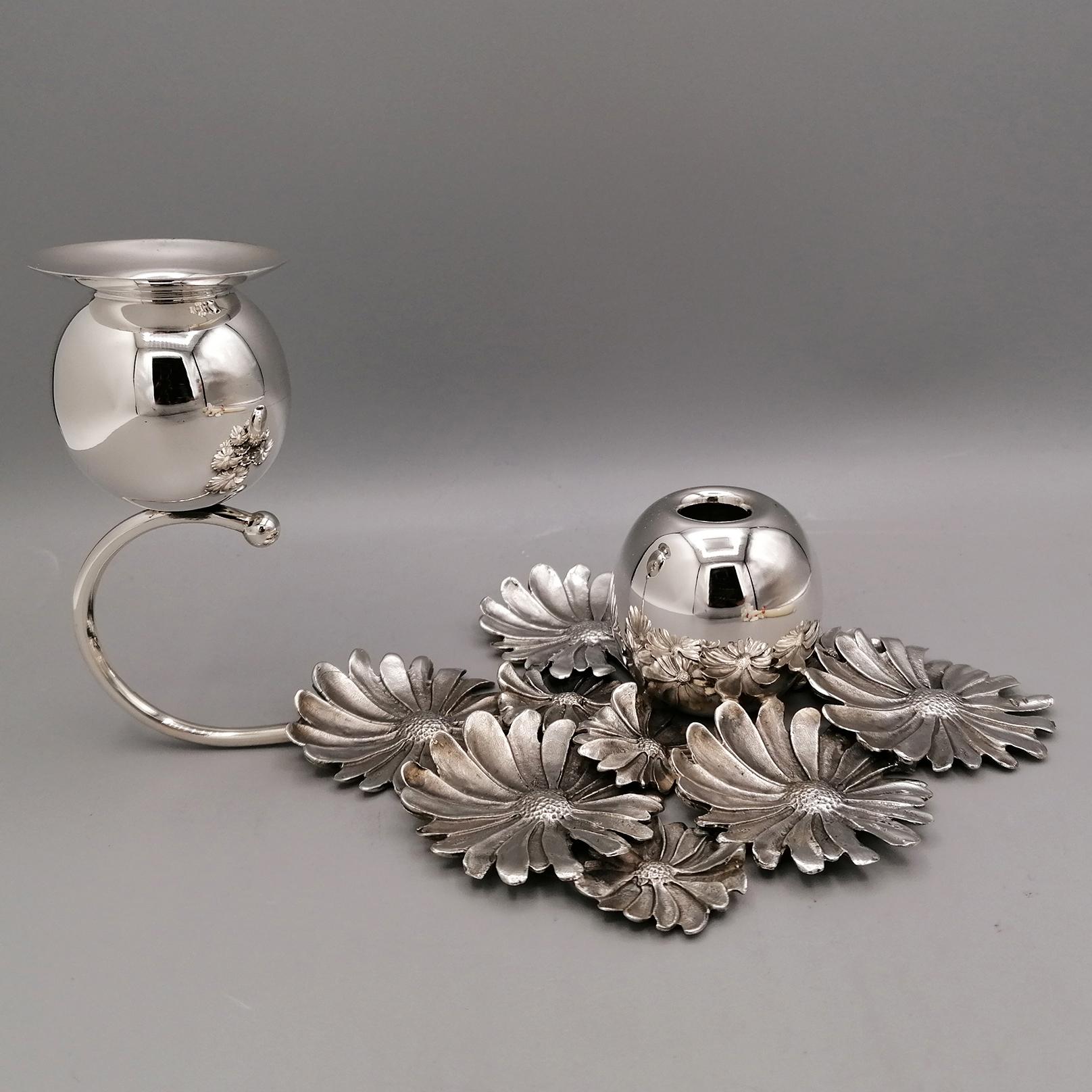 Attractive one-light candlestick/flower holder.
The base of the candlestick is made with daisy flowers made of Sterling silver using the fusion technique and then chiseled by hand to make the daisies look similar to real flowers.
Subsequently, a