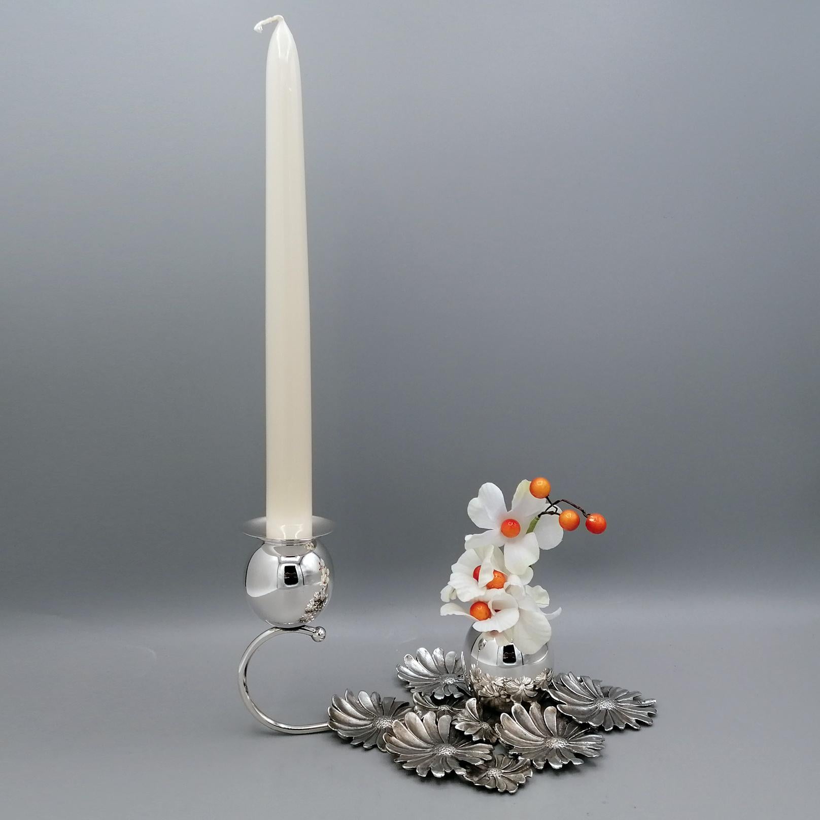 Attractive one-light candlestick/flower holder.
The base of the candlestick is made with daisy flowers made of Sterling silver using the fusion technique and then chiseled by hand to make the daisies look similar to real flowers.
Subsequently, a