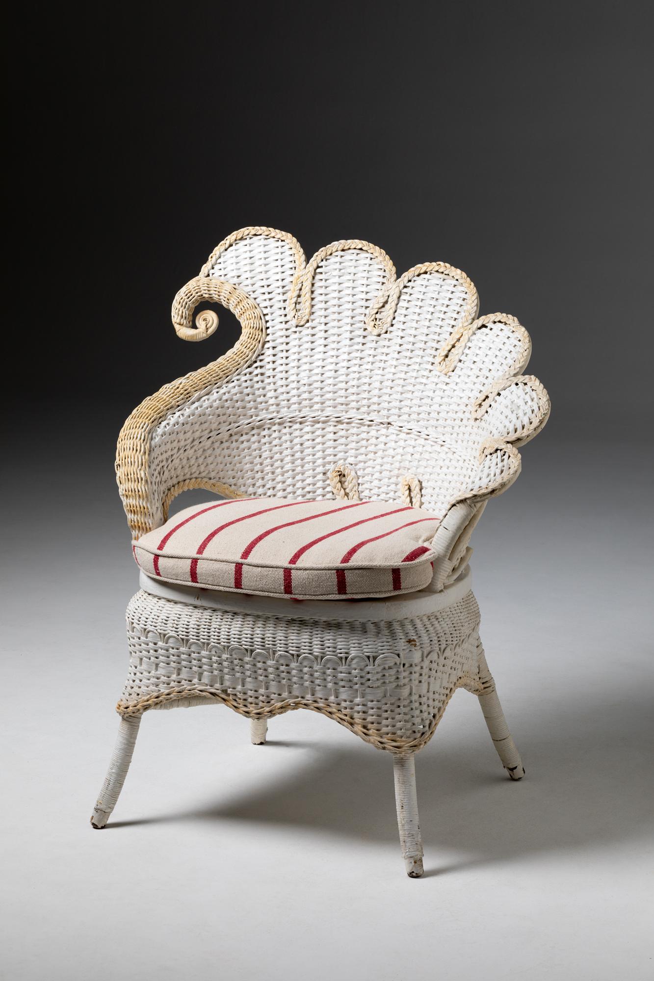 XX Century Rattan Chair painted in white colour

The Ratan Chair, painted in a pristine white hue, epitomizes the simplicity and elegance of 20th-century design. Crafted from durable rattan, this chair seamlessly blends form and function. Its sleek