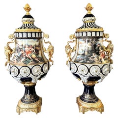 20th century, Pair of Sevres porcelain vases with gilded bronze