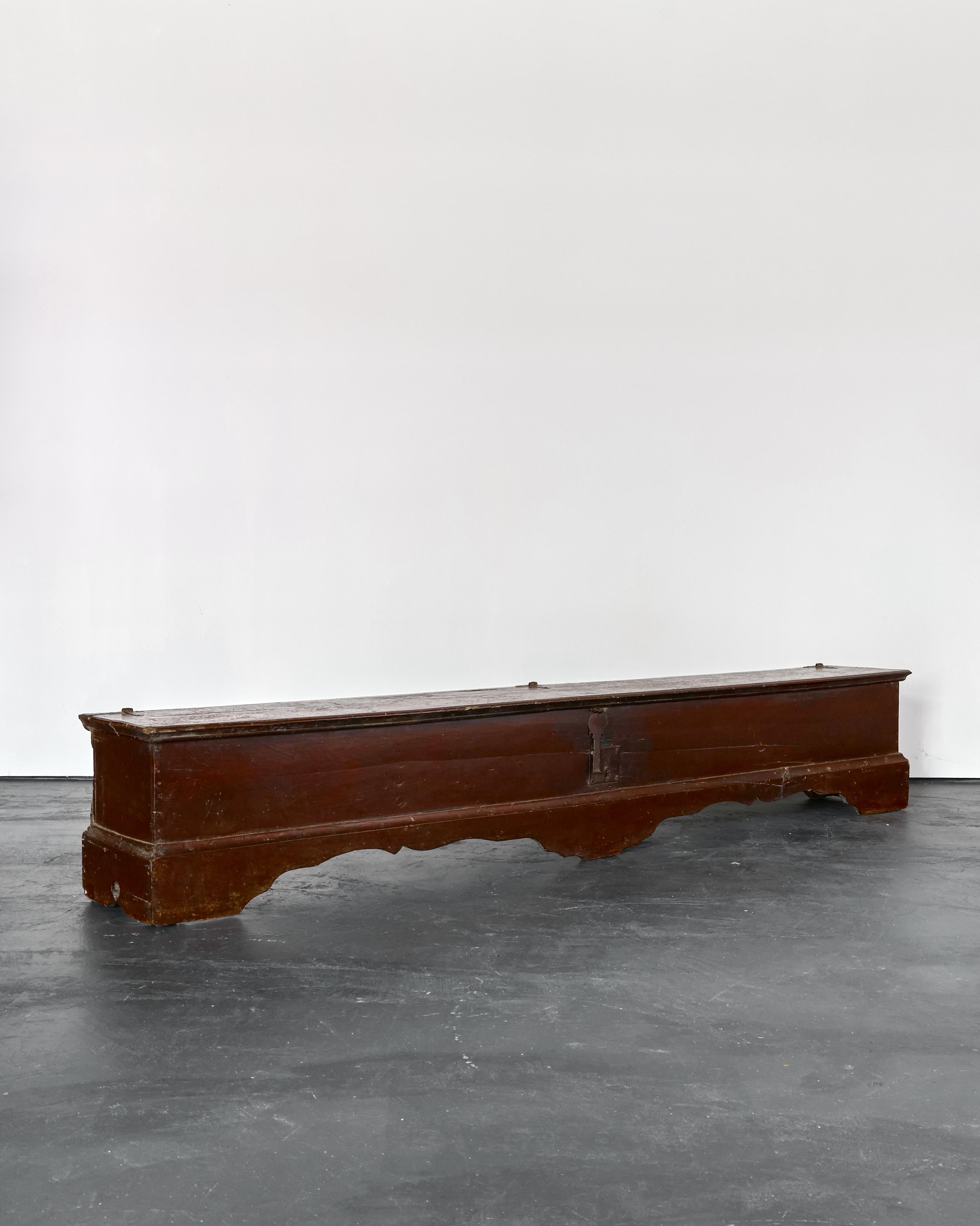 An incredible XXL 18th C. Catalan coffer/bench from the province of Girona.

Solidly constructed with original forged iron hardware.

Heavily patinated in original oxblood painted finish.

Many age old repairs.

Very well proportioned.