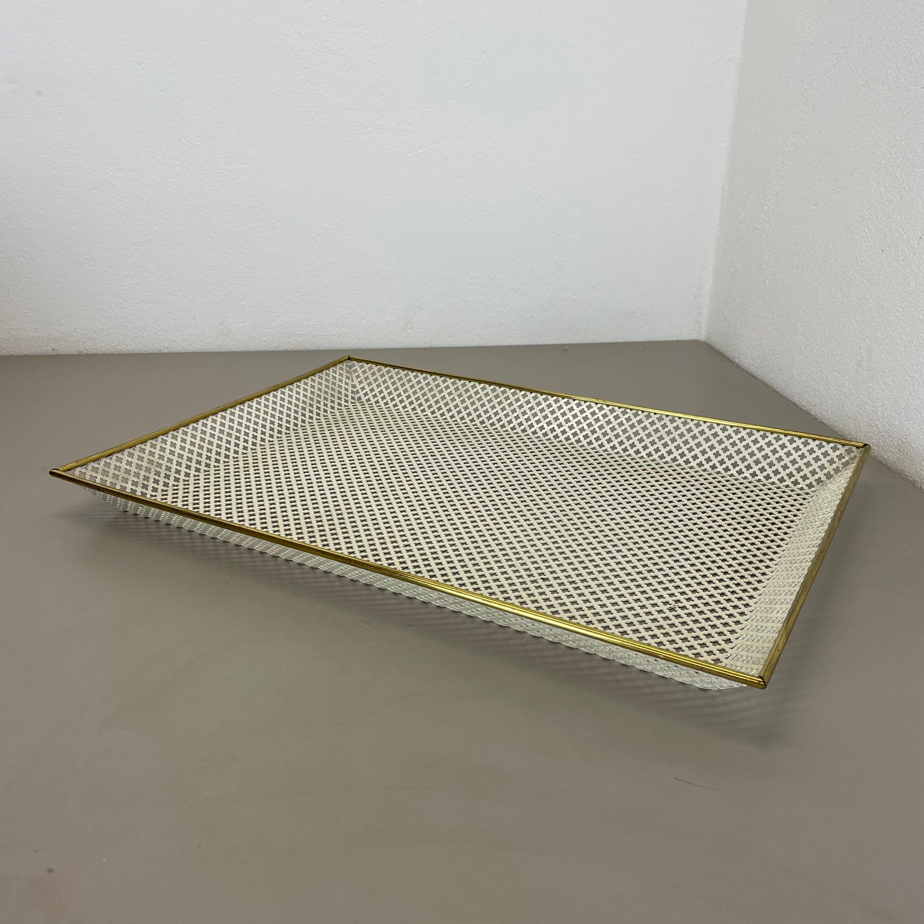 Article:

Tray element with hole pattern


Designer and Producer:

Mathieu Mategot




Origin:

France


Material:

metal and brass


Decade:

1950s


Description:

This original midcentury tray element was designed and produced in the 1950s in