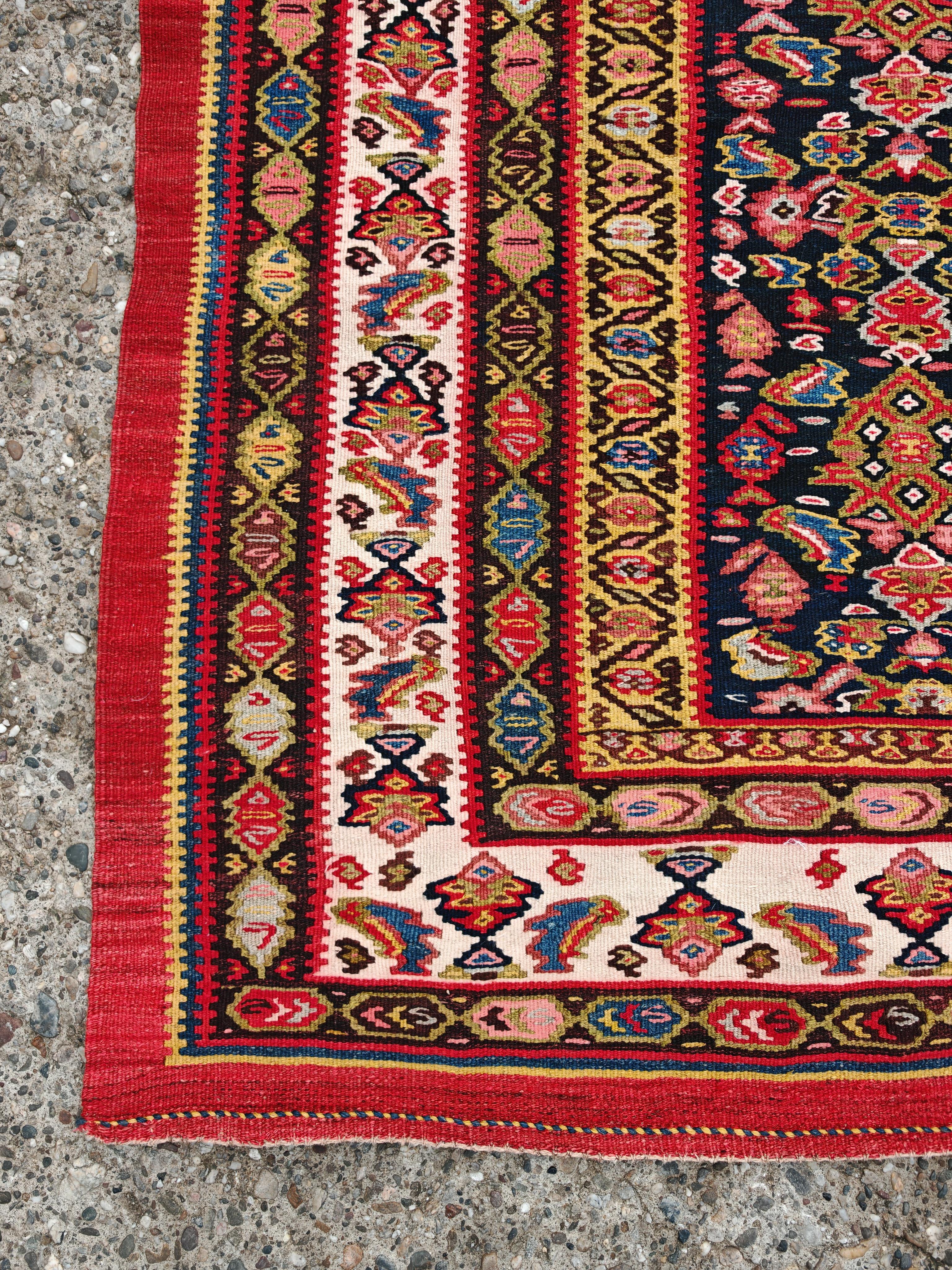 Caucasico XXL Antique hand-woven Senneh Kilim with geometric pattern, Caucasus 1920s in vendita