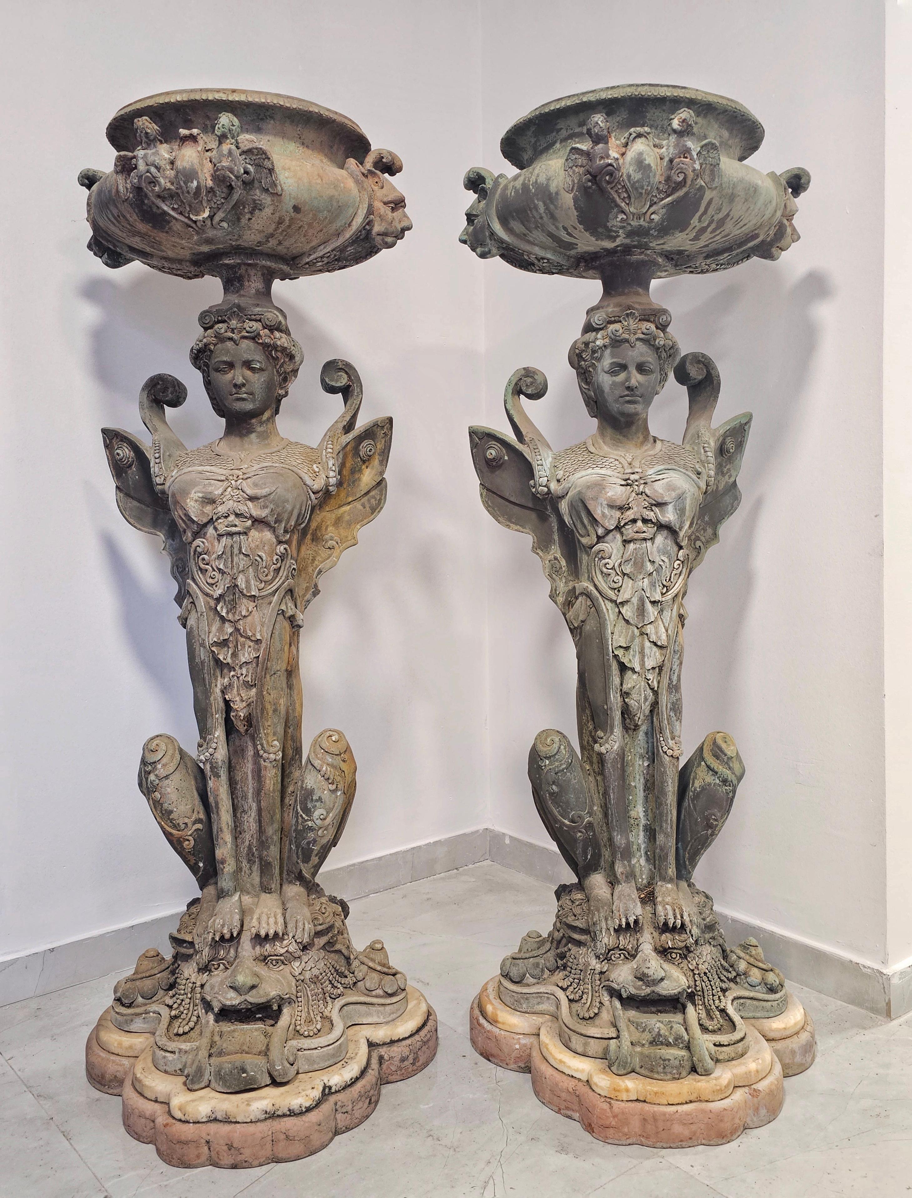 In this listing you will find a pair of extra large French Empire jardinieres. They are done in bronze and have the base made of two types of marble. The immaculate sculptural work makes these two beauties exceptionally attractive a d perfect for a