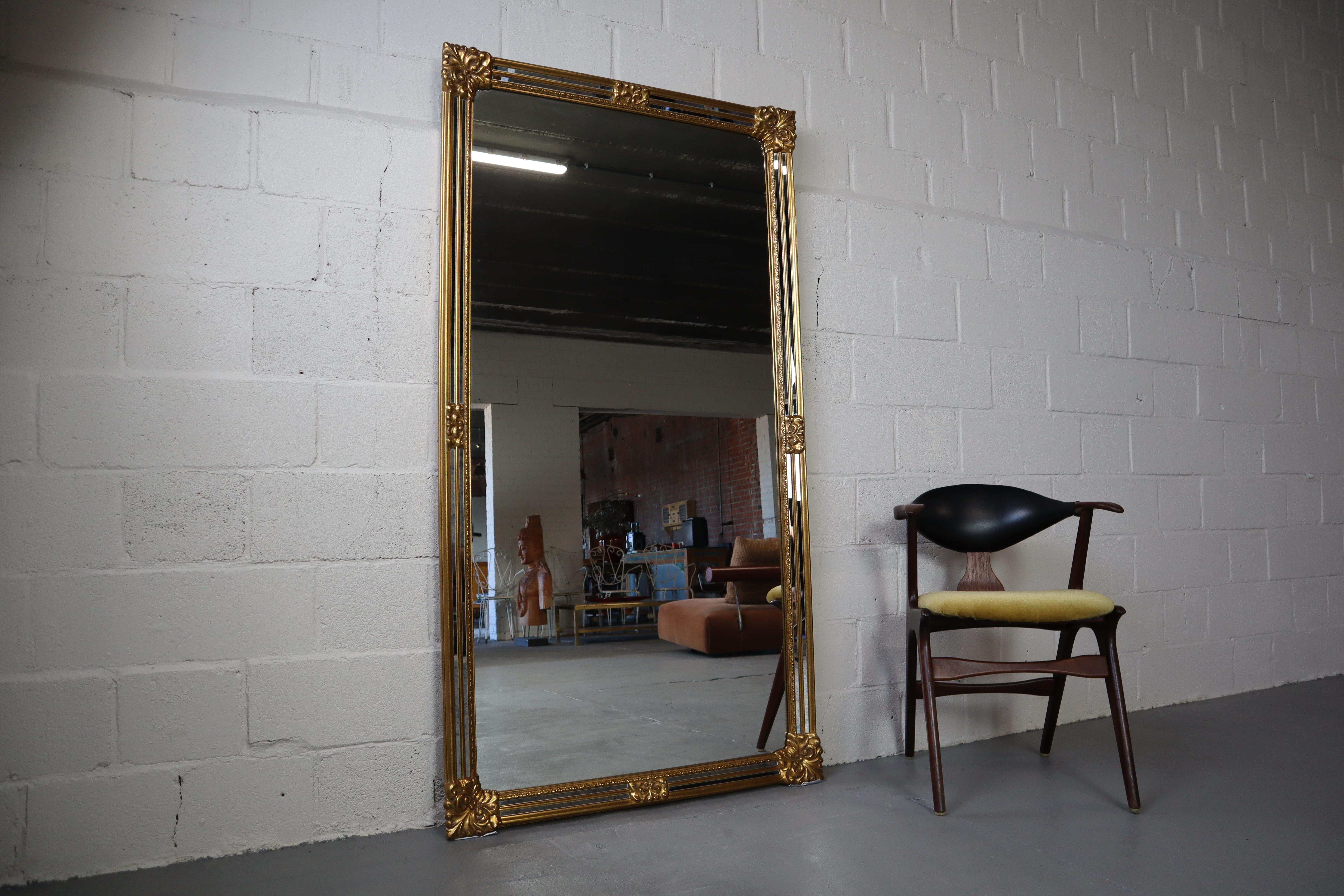 Gigantic vintage facet cut luxury mirror by Deknudt! Gilded frame, inlaid with strips of veined mirror glass.
Deknudt is known for its high quality mirrors!
You can hang it horizontally or vertically.
Perfect condition!
185x98x6cm.