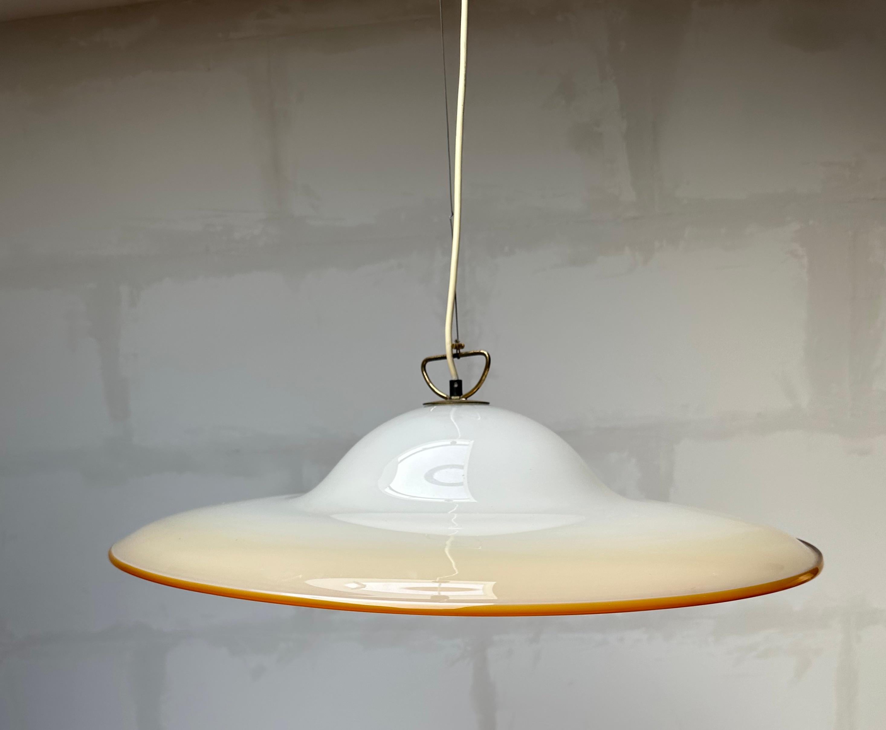 Great shape, mouthblown Venetian light fixture by Seguso.

If you are looking for a rare and stylish mid-20th century fixture to grace your home then this handcrafted Italian light could be perfect. One person might see an upside down vortex of