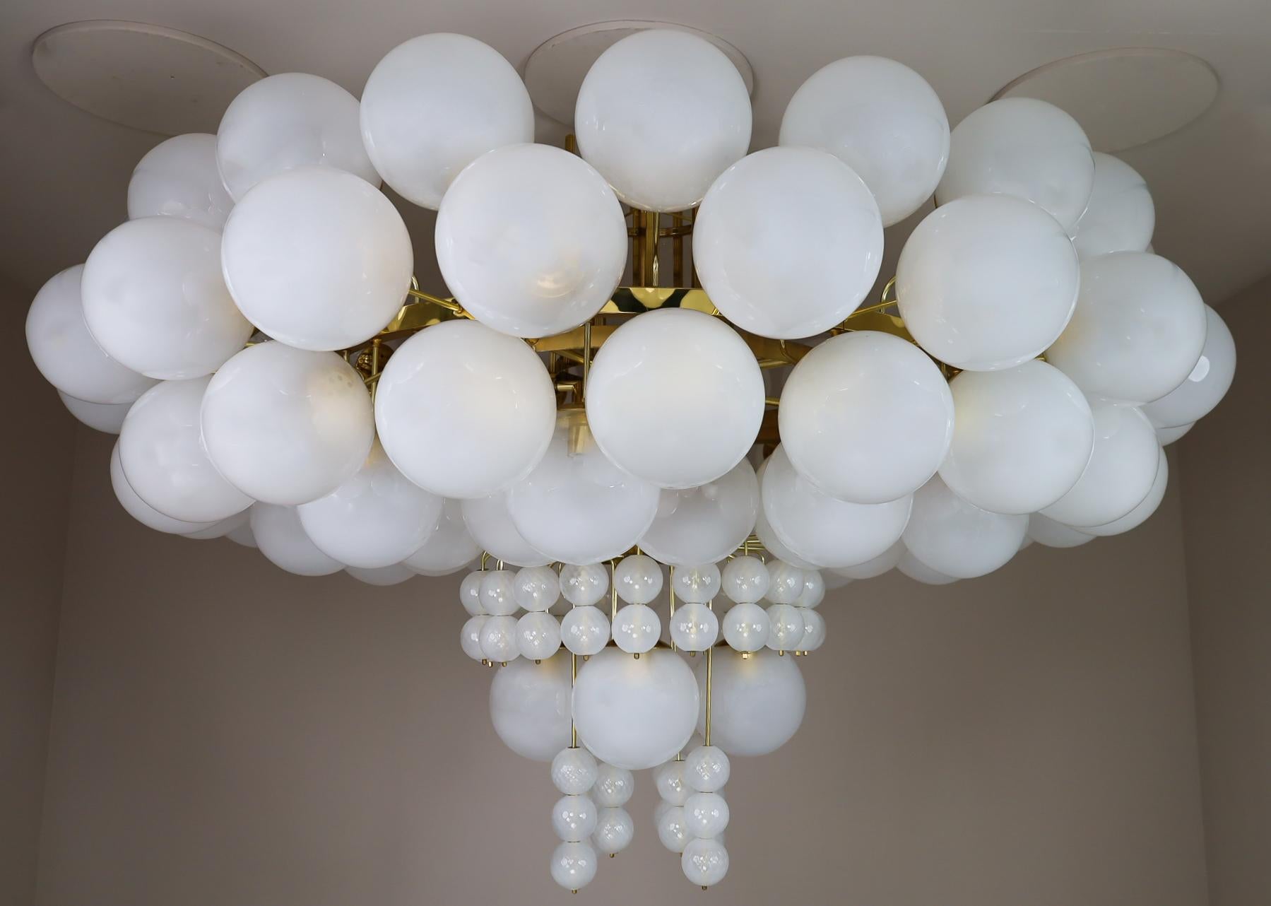 XXL hotel chandelier with brass fixture and hand-blowed frosted glass globes by Preciosa, Czechia.

Extremely large diameter 7.2 Ft / 86 Inch hotel chandelier with brass fixture produced and designed in Czechia by the famous Preciosa Factory.