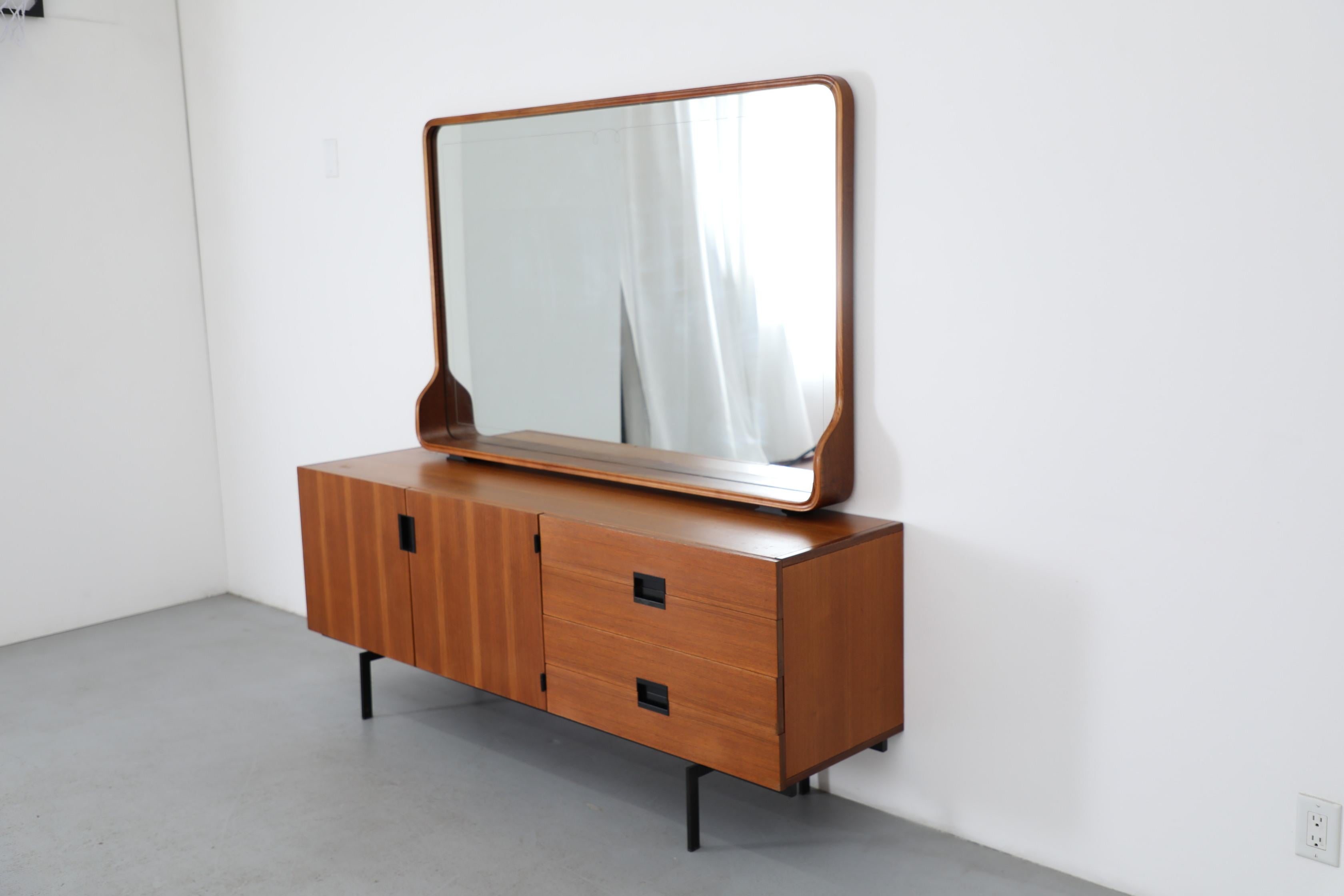 Extra large Italian Mid-Century standing mirror showcases the sophisticated craftsmanship of 1960s Italian design. Hand-carved wooden frame features gracefully curved edges and beautiful natural grain patterns, while subtle carved feet provide