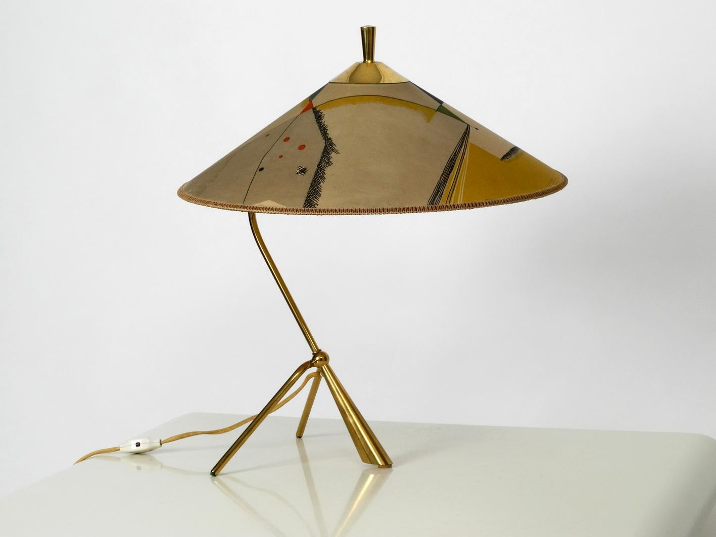 Beautiful very rare extra extra large Mid-Century Modern brass table lamp with original fabric shade. Made by Kalmar in the 1950s. Made in Austria. Very large original lampshade in very good condition.
Very nice typically striking midcentury design