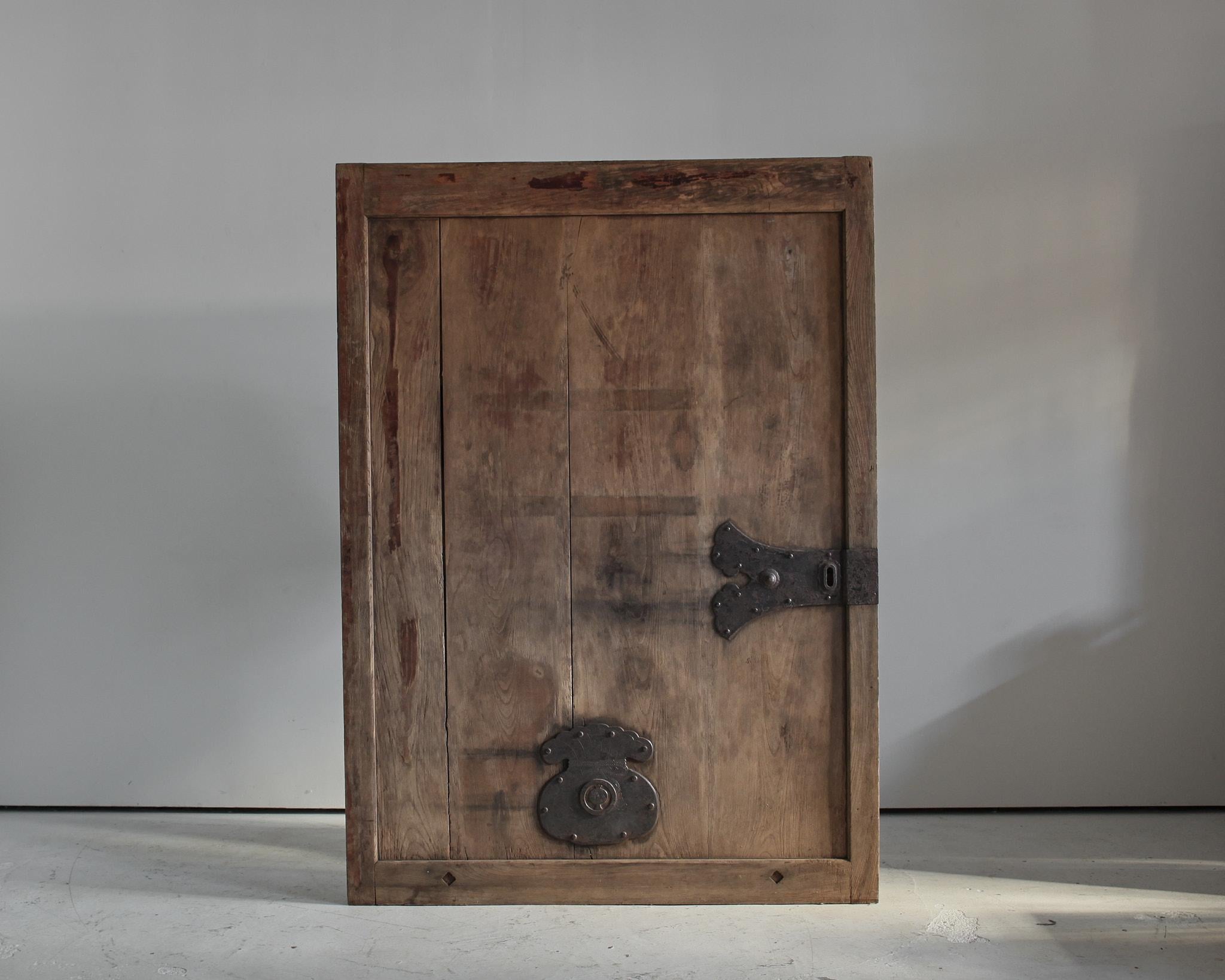 A huge early 19th C. Japanese Kura door in cedar.

Beautifully patinated bleached-out wood with hand forged wrought iron plaque/lock.

Can either be used as a door or a large art work.