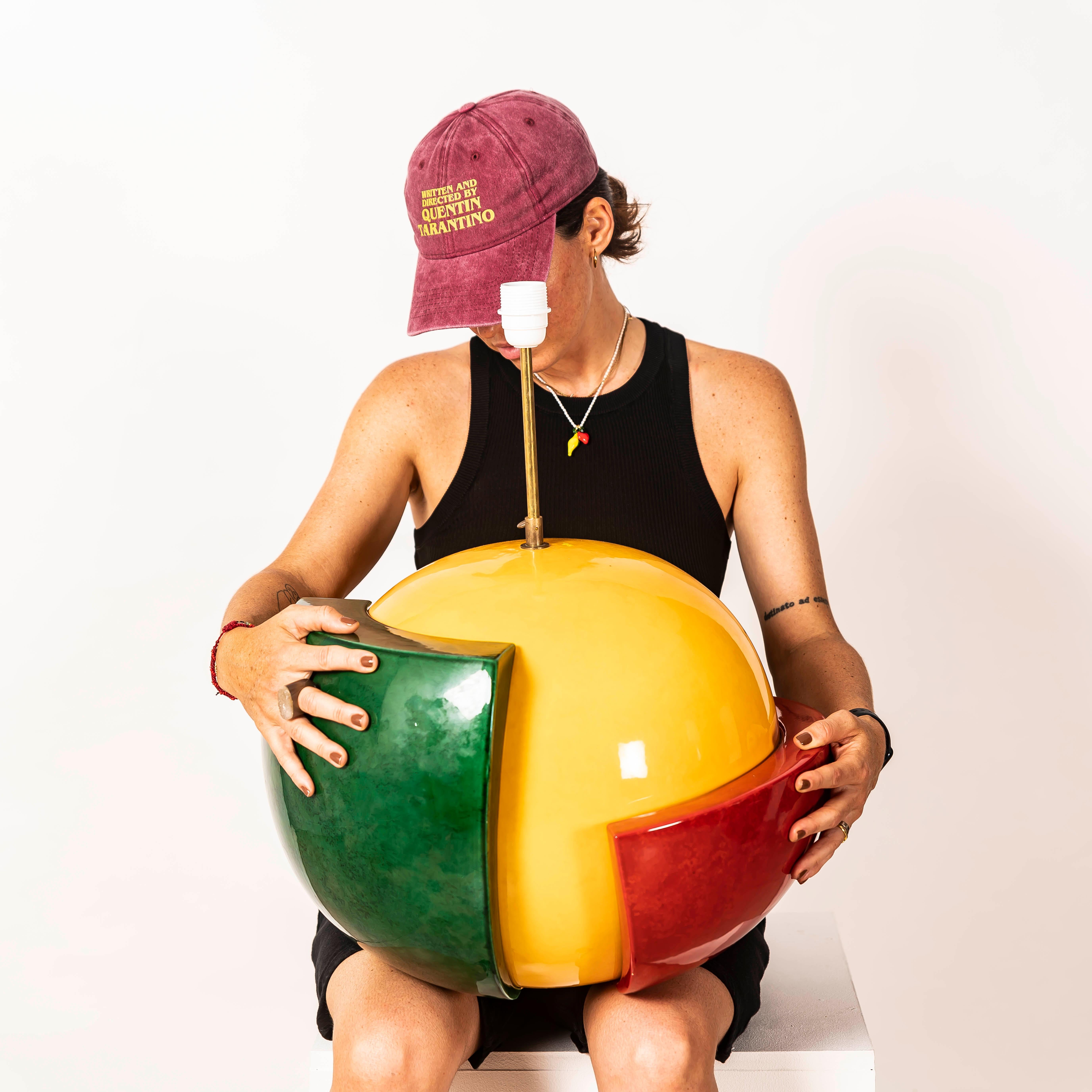 Bold, sculptural, and unmistakably postmodern, this XXL ceramic table lamp was designed by François Chatain in France during the 1980s. With its commanding form and saturated color palette —deep red, vibrant yellow, and rich emerald green—the piece