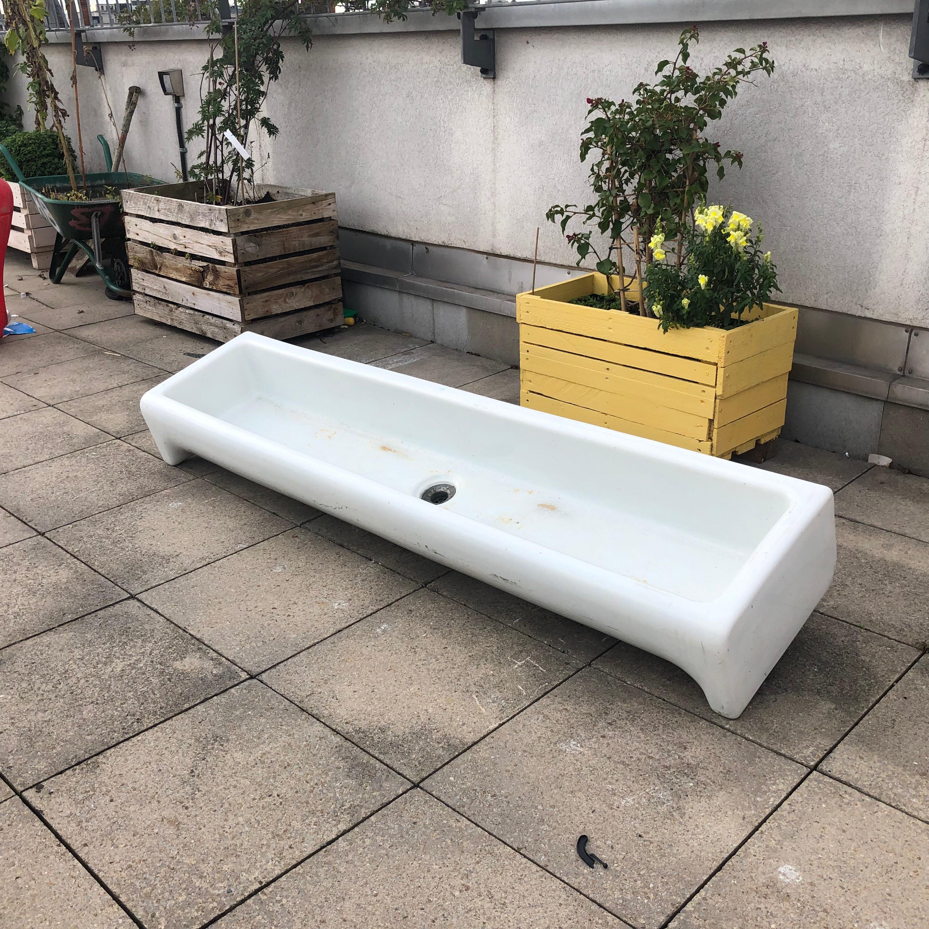 Very rare large 1920s rectangular porcelain sink reclaimed from a boys school just outside London.

This sink would be perfect with few taps on the wall ether for restaurants, hotels or any other commercial or even residential projects. 
Signed