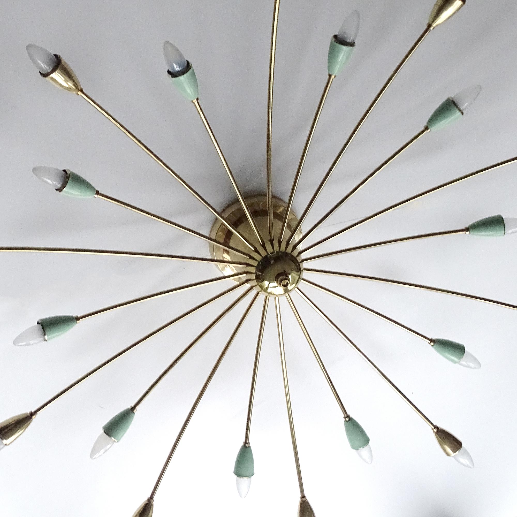 Very large Italian Sputnik light, featuring a 2-tiers array of 20 spokes, 10 short, 10 long, brass structures with alternating jade green enameled and brass fittings caps mounted on very large center cone piece for direct ceiling mount - NOT A