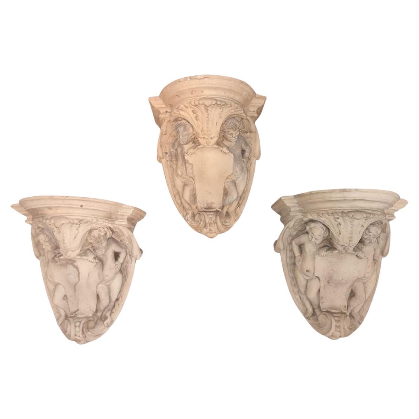 XXth century group of three terracotta shelves For Sale