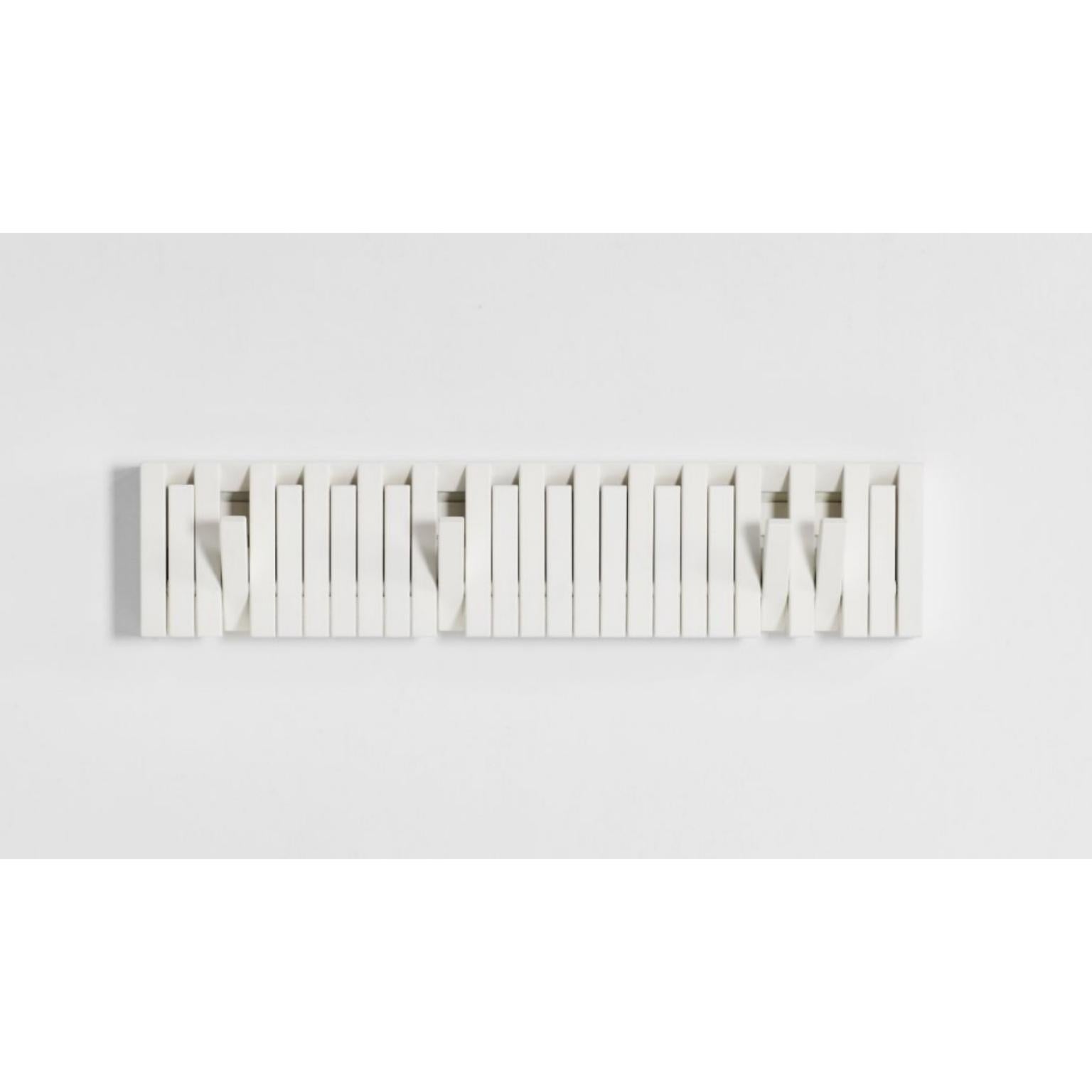 Xylo coat rack by Patrick Séha.
Dimensions: 81 x H 20 cm
Materials: Beech lacquered white.

Available in various wood finishes.

The XYLO is a wall-mounted coat rack with foldable hooks, inspired by the PIANO hanger panel designed by Patrick