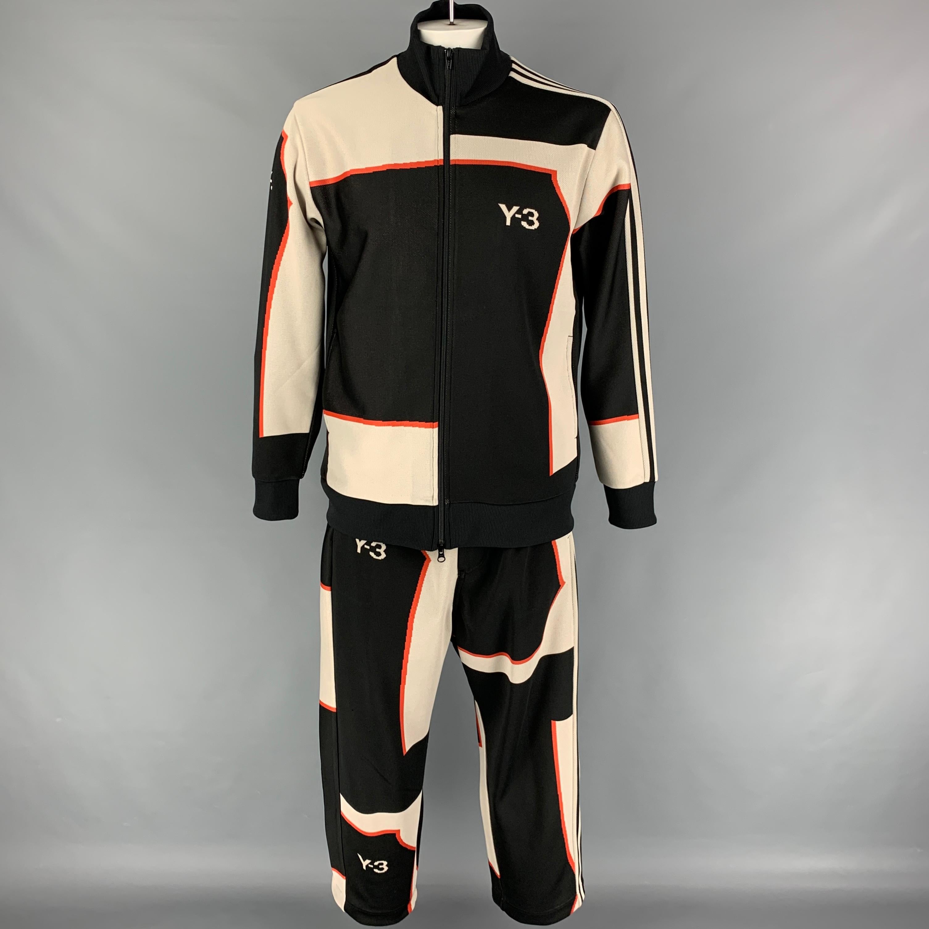 Y-3 by YOHJI YAMAMOTO track suit comes in a black & cream color block polyester featuring a high collar, ribbed hem, full zip up closure, and matching sweatpants.

Excellent Pre-Owned Condition.
Marked: XL

Measurements:

-Jacket
Shoulder: 19